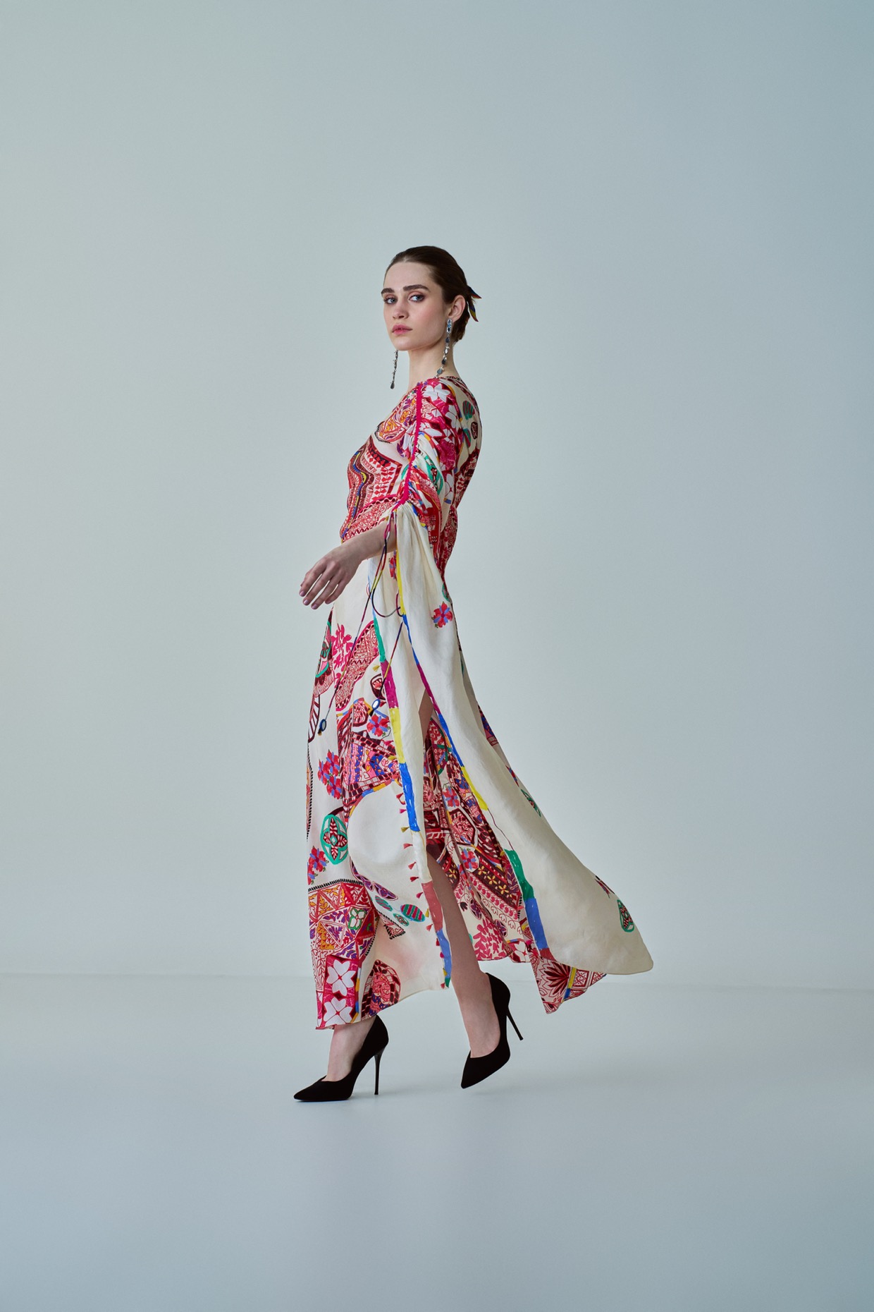 A model showcasing Isla Kaftan Asymmetric One Shoulder Kaftan by Saaksha And Kinni from Saaksha And Kinni's collection