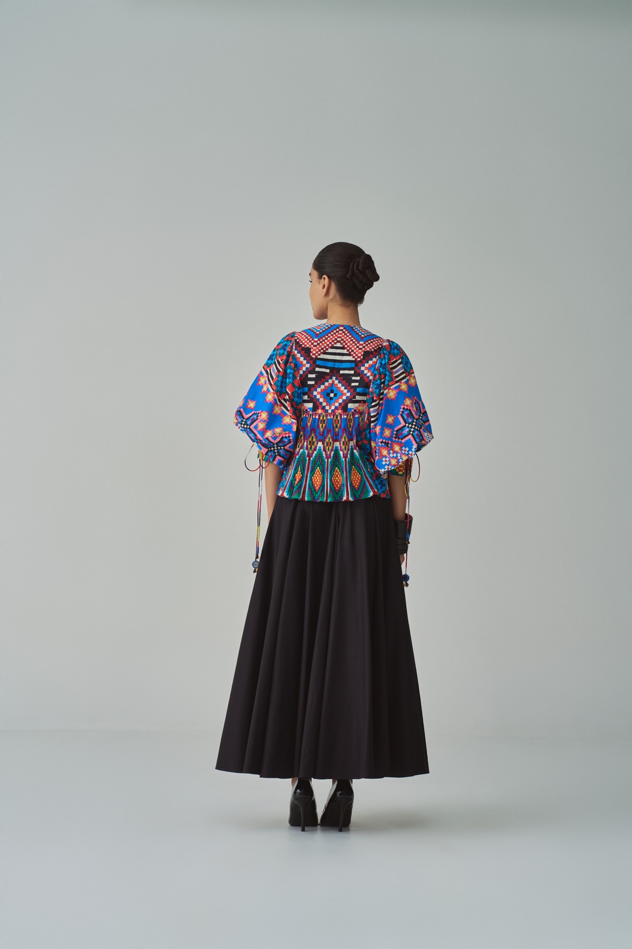 A model showcasing Blue Tanya Blouse by Saaksha And Kinni from Saaksha And Kinni's collection