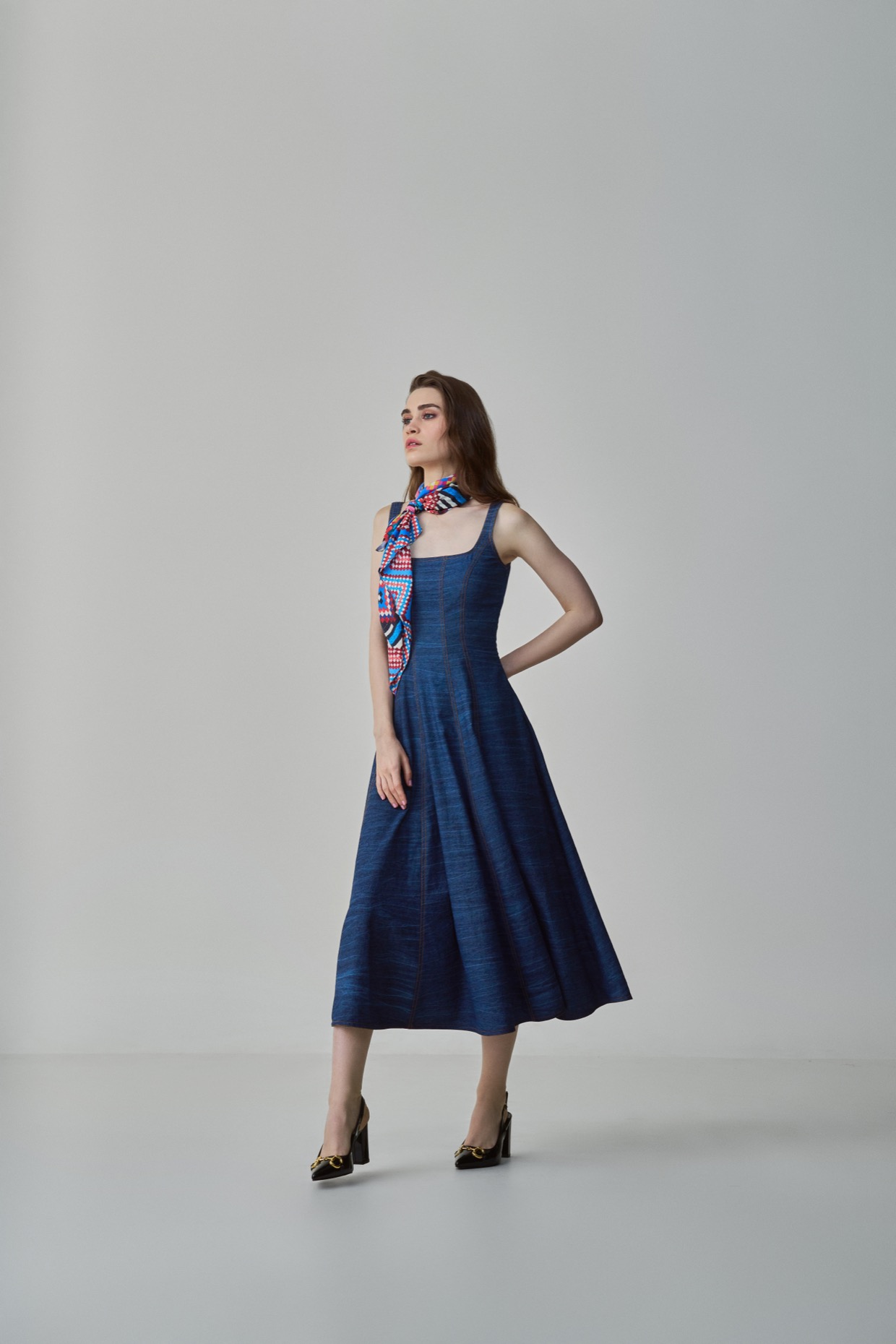 A model showcasing Emily Dress Blue Denim Midi Dress by Saaksha And Kinni from Saaksha And Kinni's collection