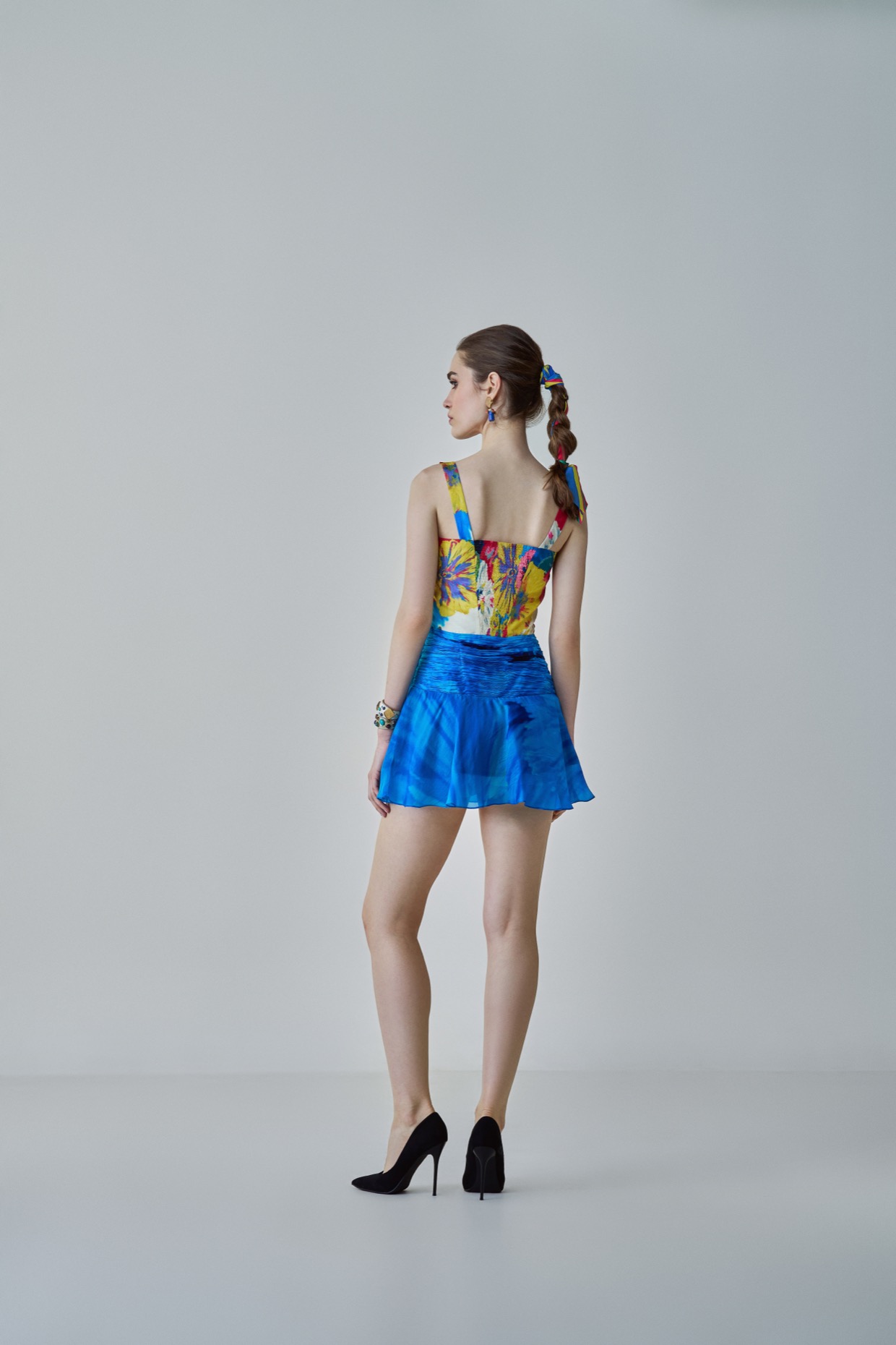 A model showcasing Erin Dress Blue Floral Mini Dress by Saaksha And Kinni from Saaksha And Kinni's collection