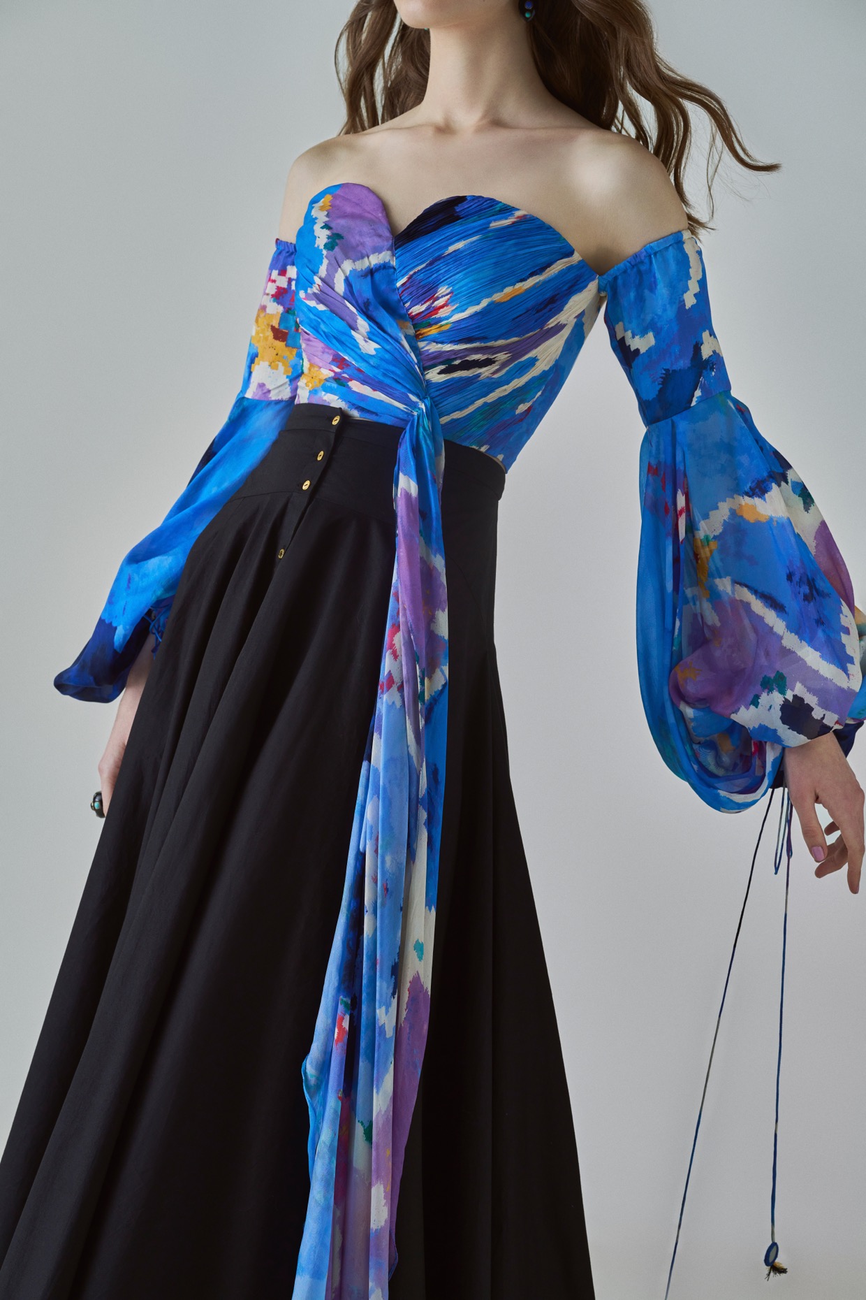 A model showcasing Taloola Blouse Blue Cold Shoulder Blouse by Saaksha And Kinni from Saaksha And Kinni's collection