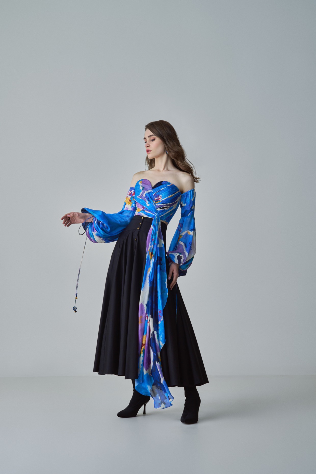 A model showcasing Taloola Blouse Blue Cold Shoulder Blouse by Saaksha And Kinni from Saaksha And Kinni's collection