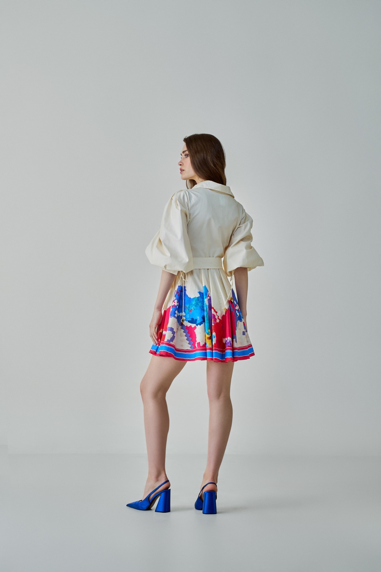 A model showcasing Faya Dress Ivory Mini Dress by Saaksha And Kinni from Saaksha And Kinni's collection