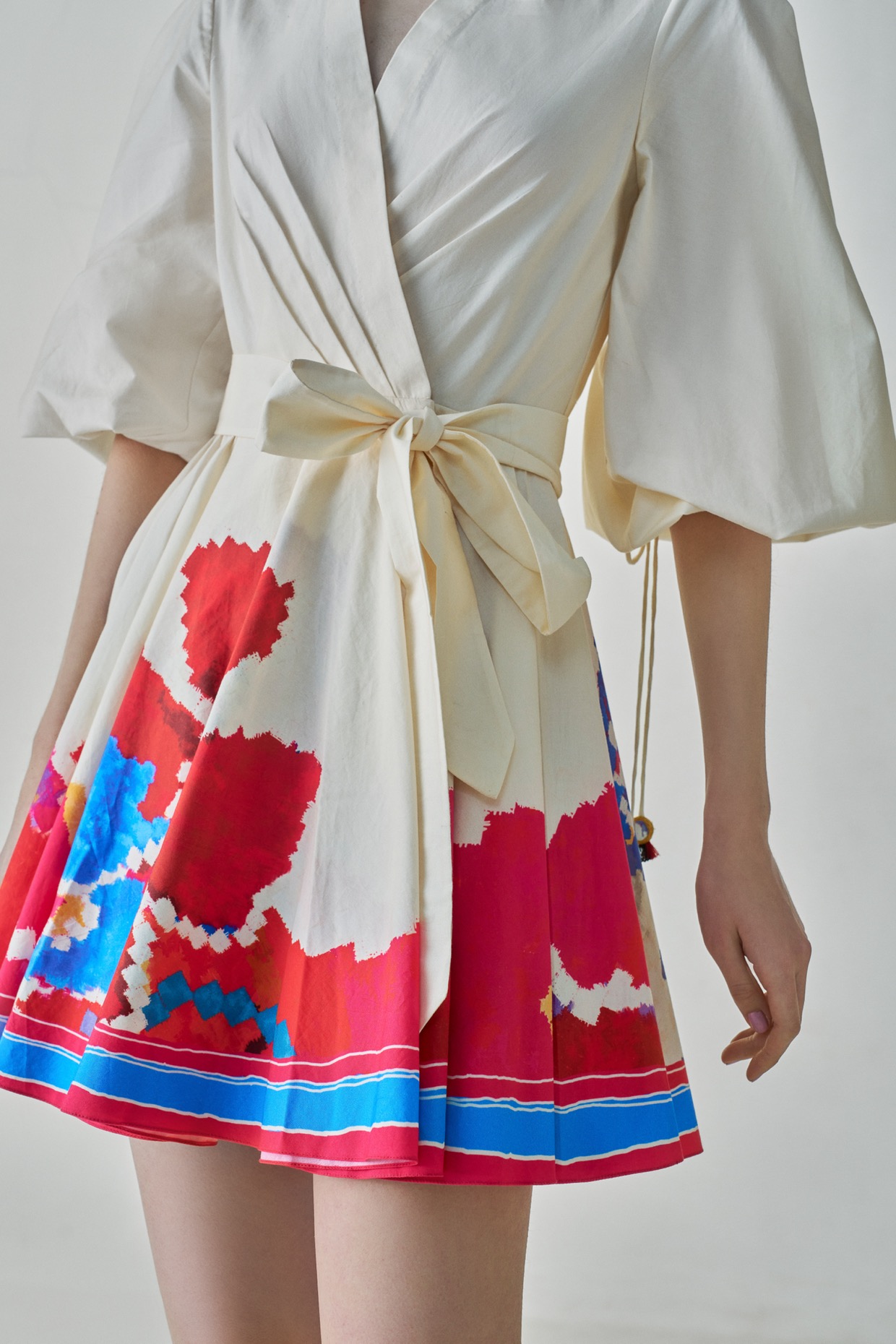 A model showcasing Faya Dress Ivory Mini Dress by Saaksha And Kinni from Saaksha And Kinni's collection