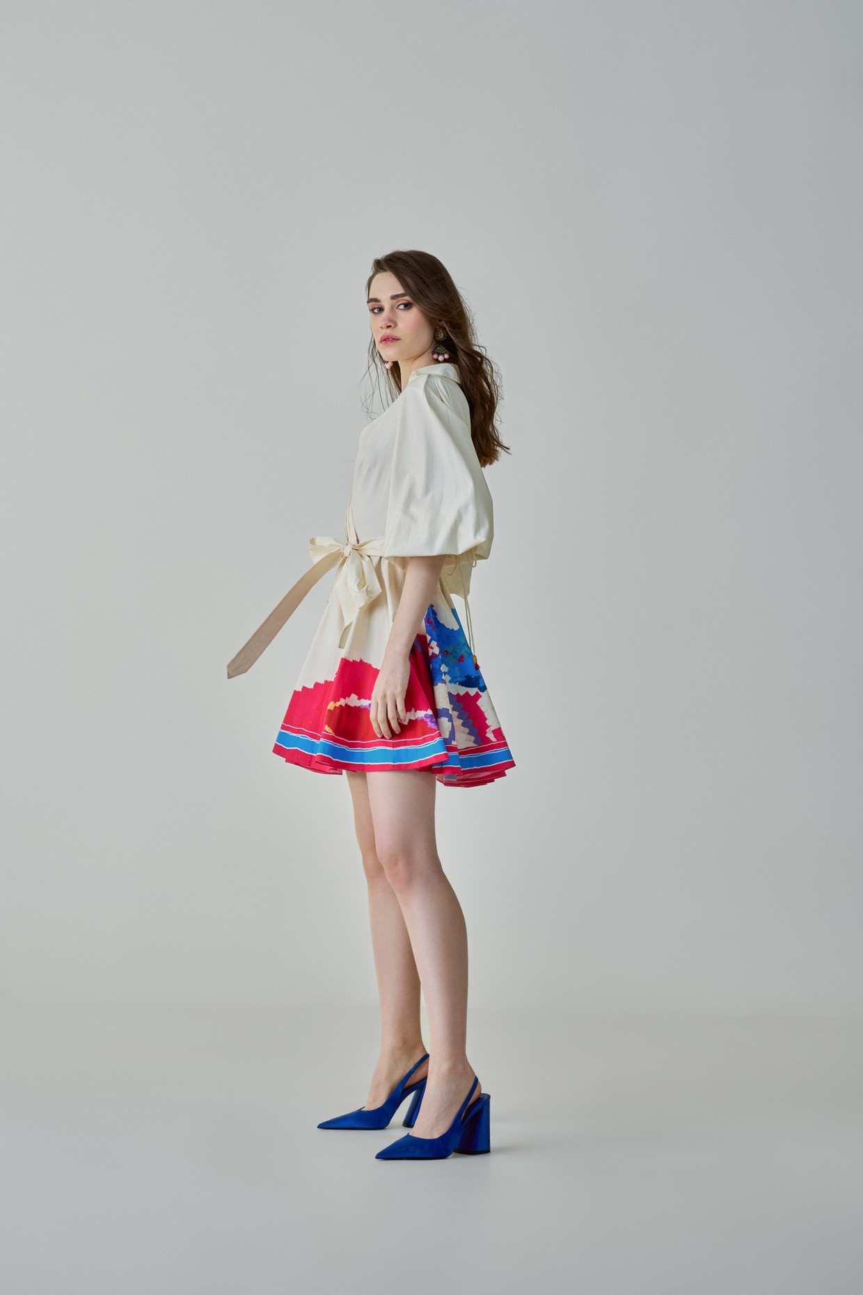 A model showcasing Faya Dress Ivory Mini Dress by Saaksha And Kinni from Saaksha And Kinni's collection