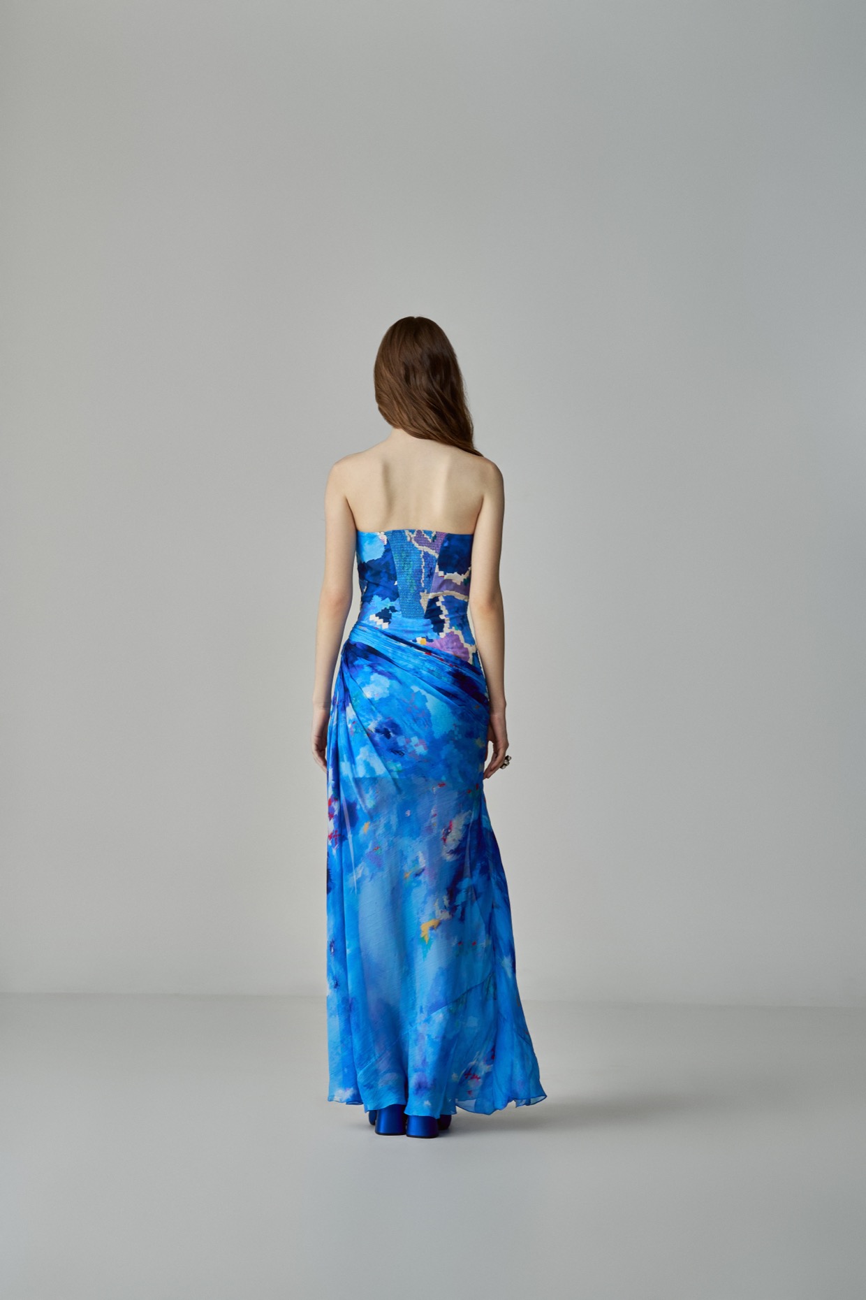 A model showcasing Anastasia Dress Blue Printed Dress With Side Slit by Saaksha And Kinni from Saaksha And Kinni's collection