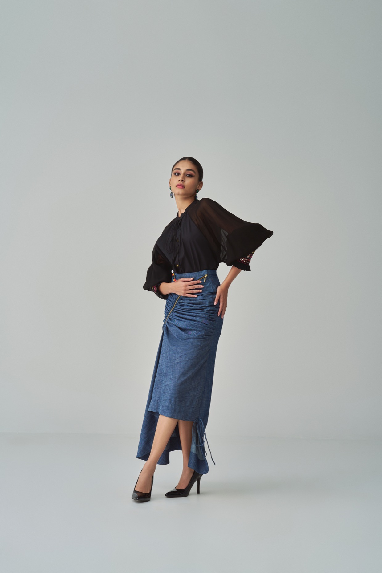 A model showcasing Tara Blouse Black Buttoned Blouse by Saaksha And Kinni from Saaksha And Kinni's collection