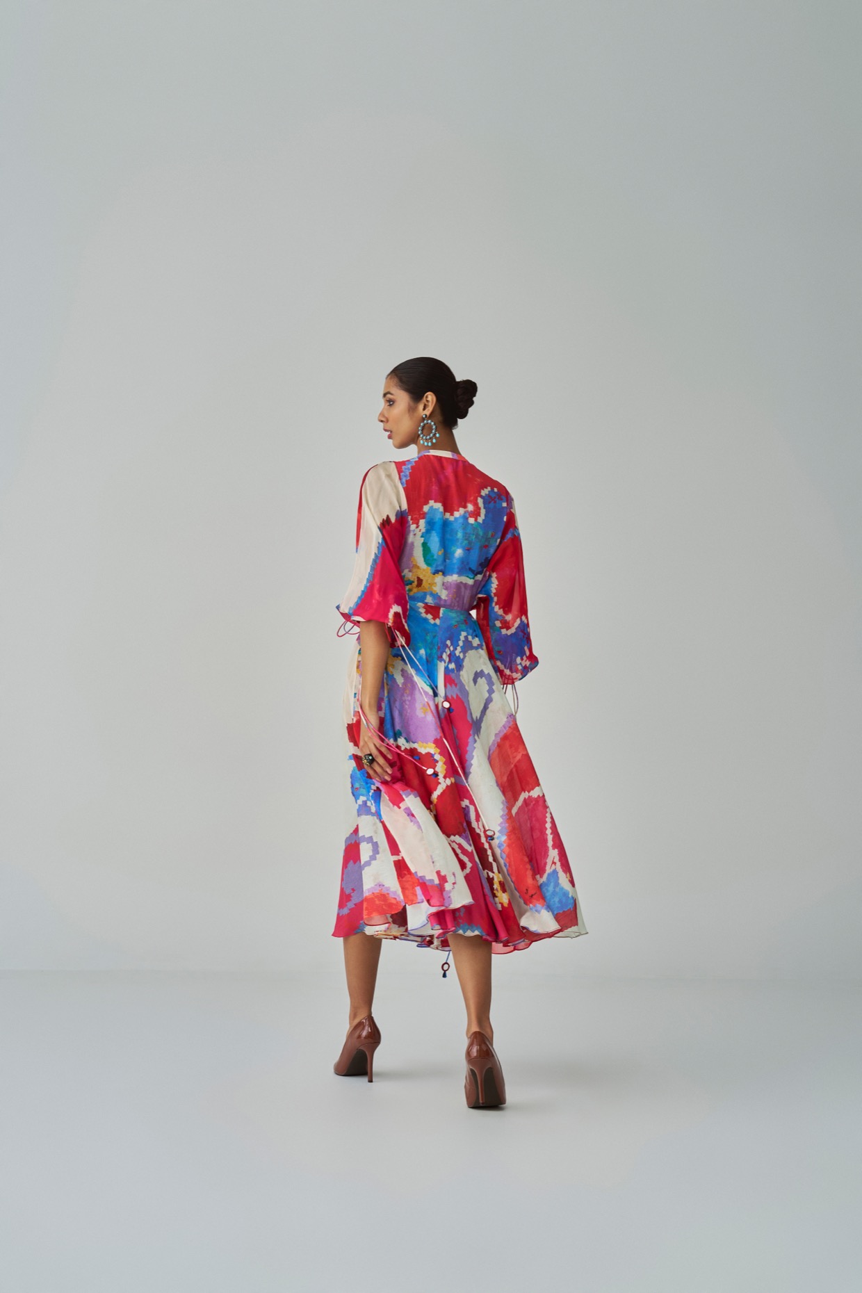 A model showcasing Pink Red Sonam Dress by Saaksha And Kinni from Saaksha And Kinni's collection