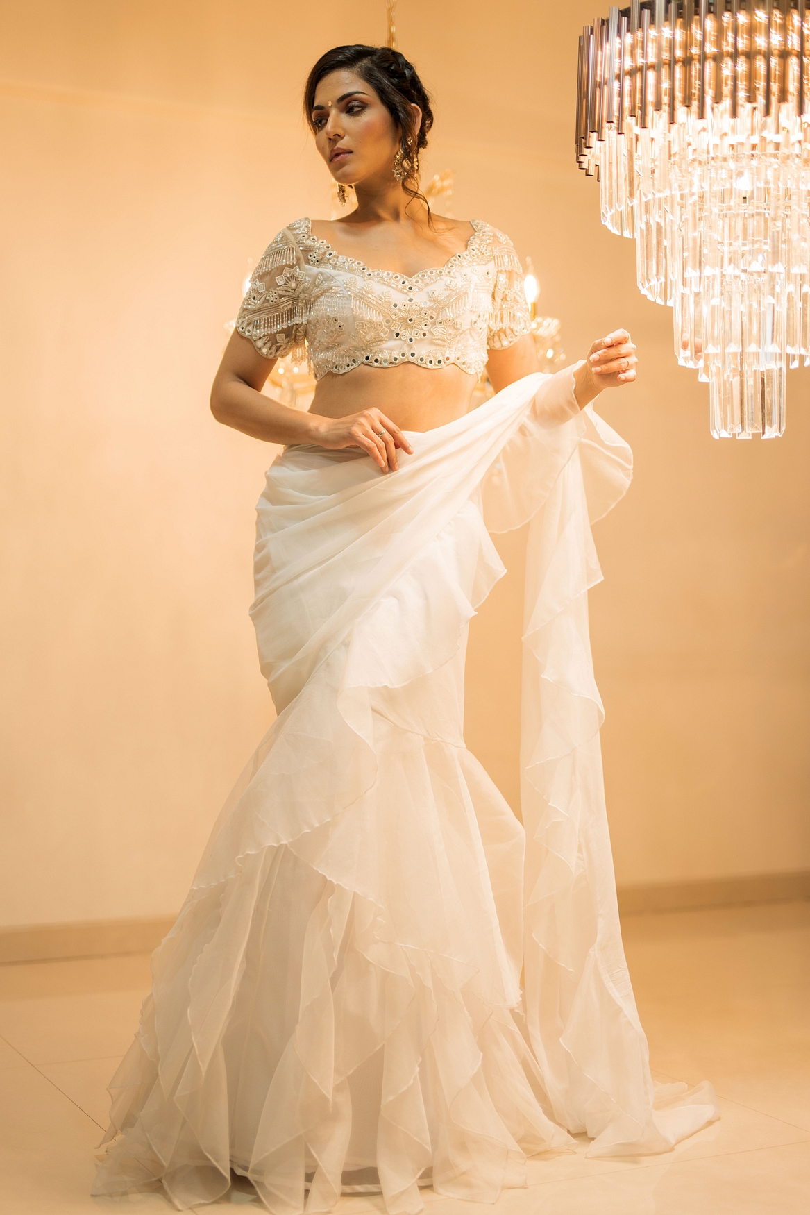 A model showcasing White Organza PreDraped Ruffle Saree Set With Belt Feature image by Foram Patel from Foram Patel's collection