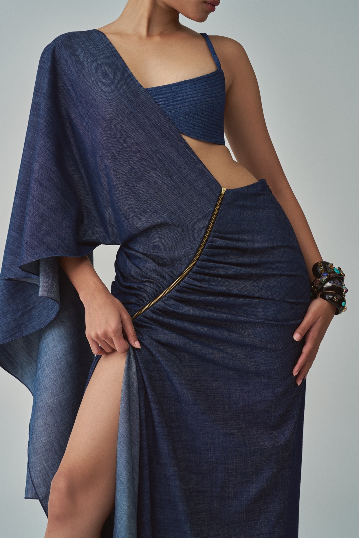 A model showcasing Lara Bralette Blue Denim Bralette by Saaksha And Kinni from Saaksha And Kinni's collection