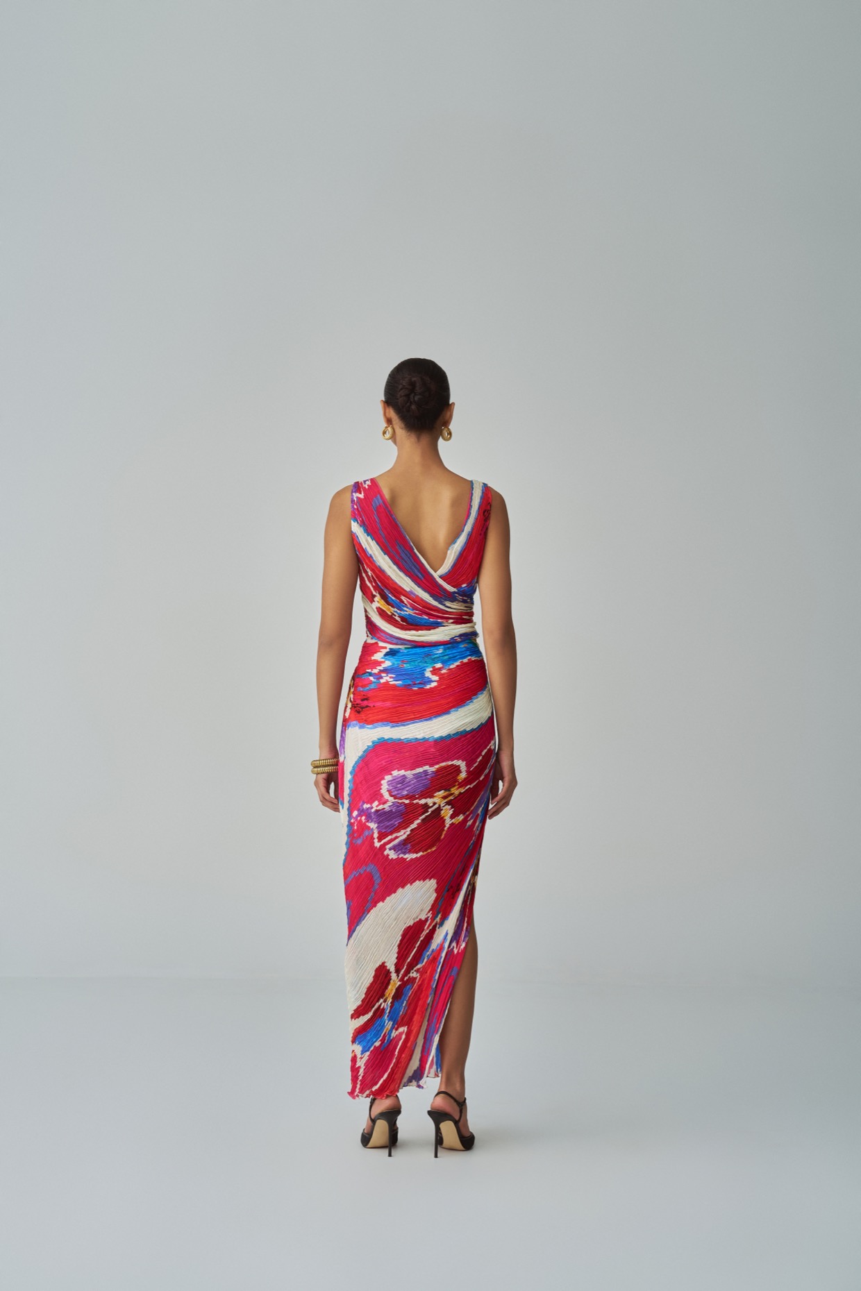 A model showcasing Anya Dress Pink Red Overlap Dress by Saaksha And Kinni from Saaksha And Kinni's collection