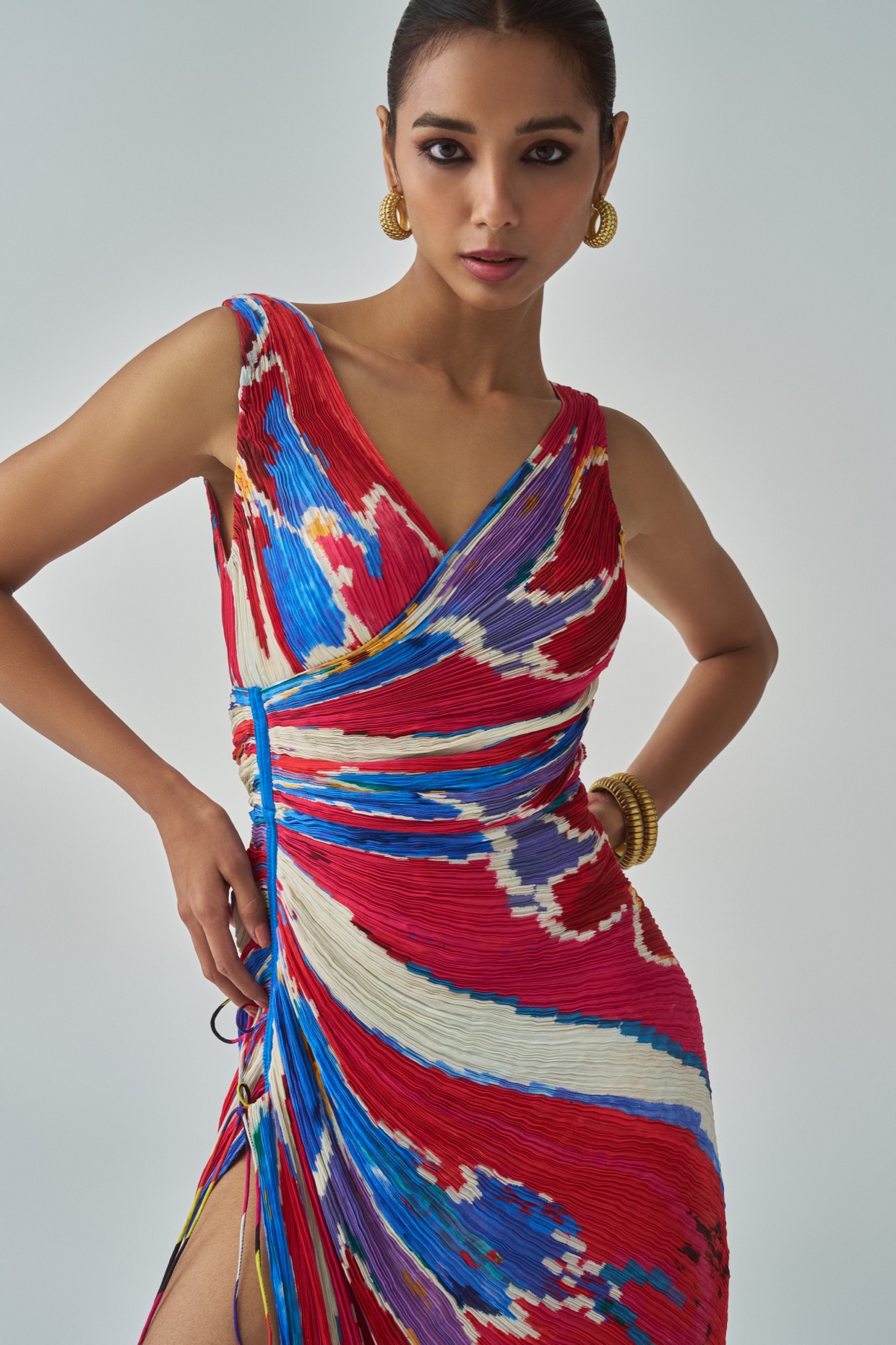 A model showcasing Anya Dress Pink Red Overlap Dress by Saaksha And Kinni from Saaksha And Kinni's collection