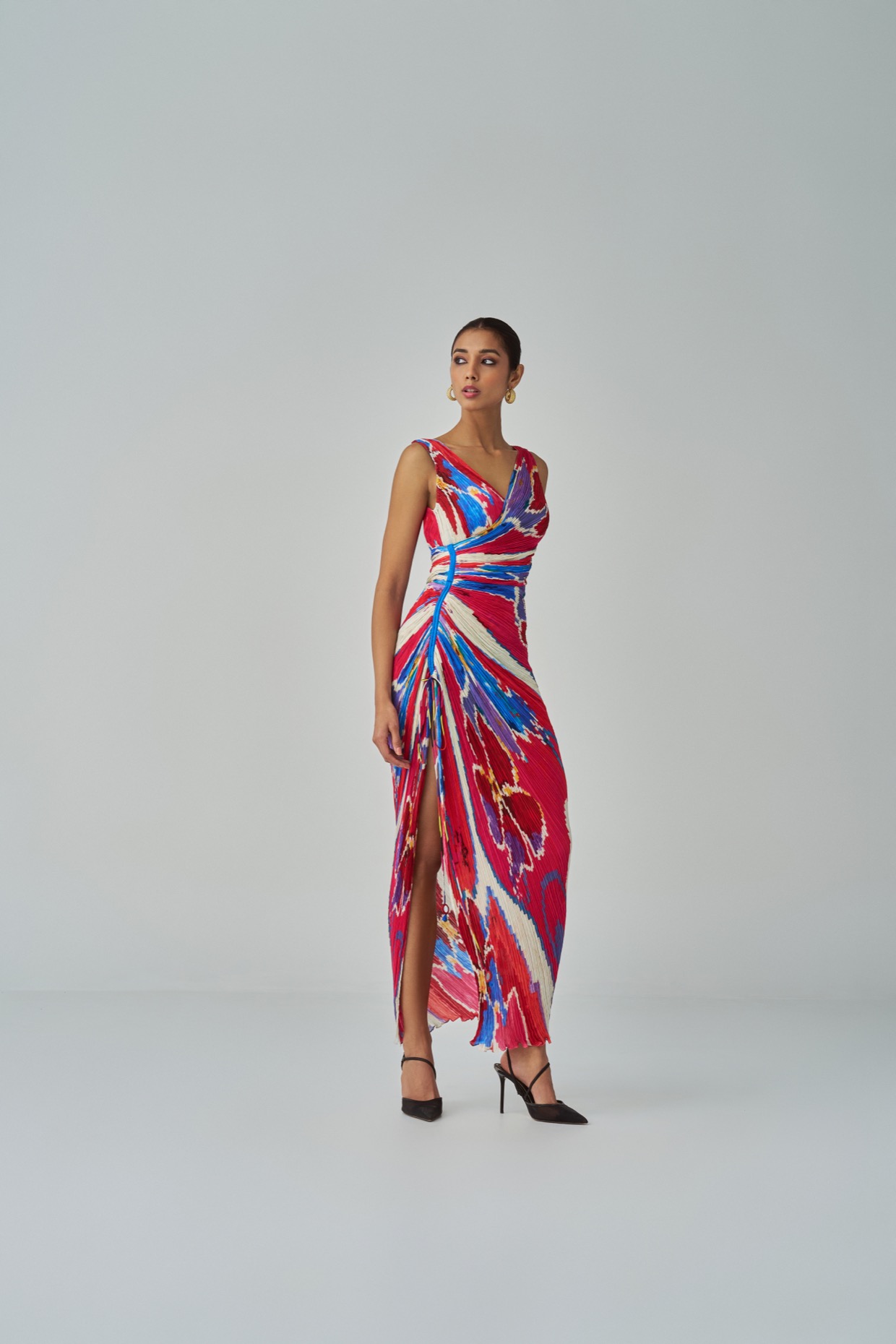 A model showcasing Anya Dress Pink Red Overlap Dress by Saaksha And Kinni from Saaksha And Kinni's collection