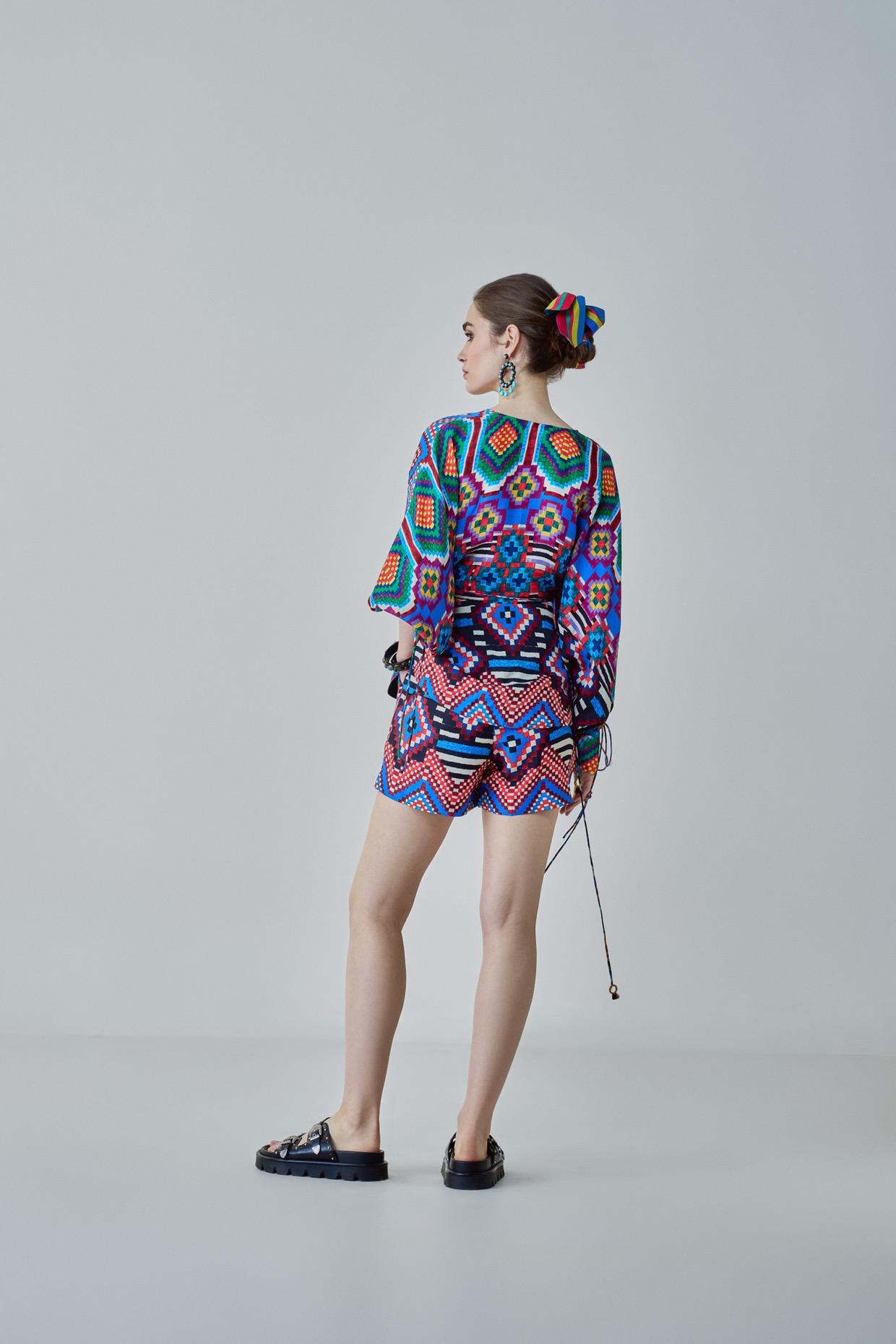A model showcasing Sia Shorts High Rise Shorts by Saaksha And Kinni from Saaksha And Kinni's collection