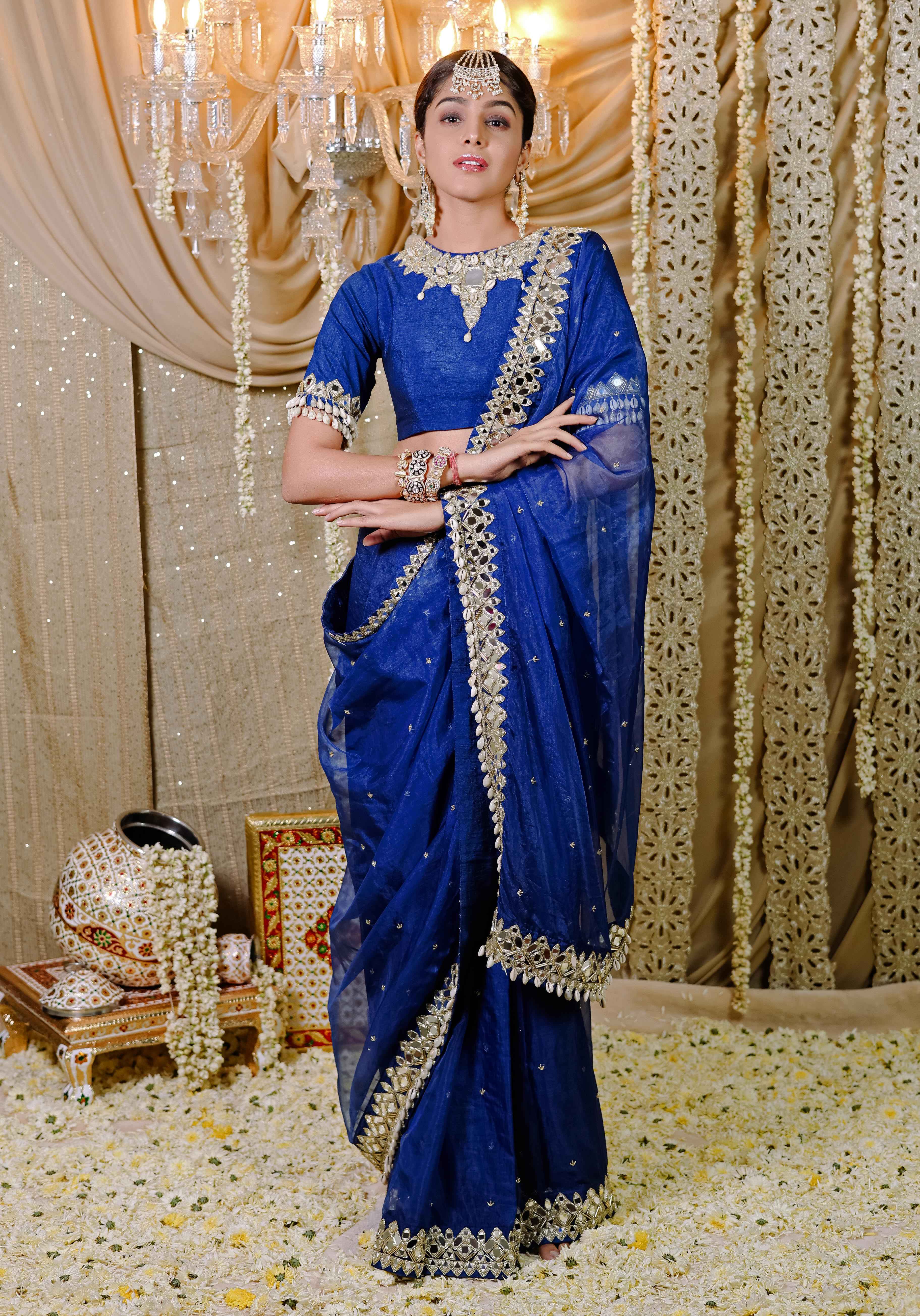 A model showcasing Dark Blue Embroidered Predraped Saree Set by Foram Patel from Foram Patel's collection