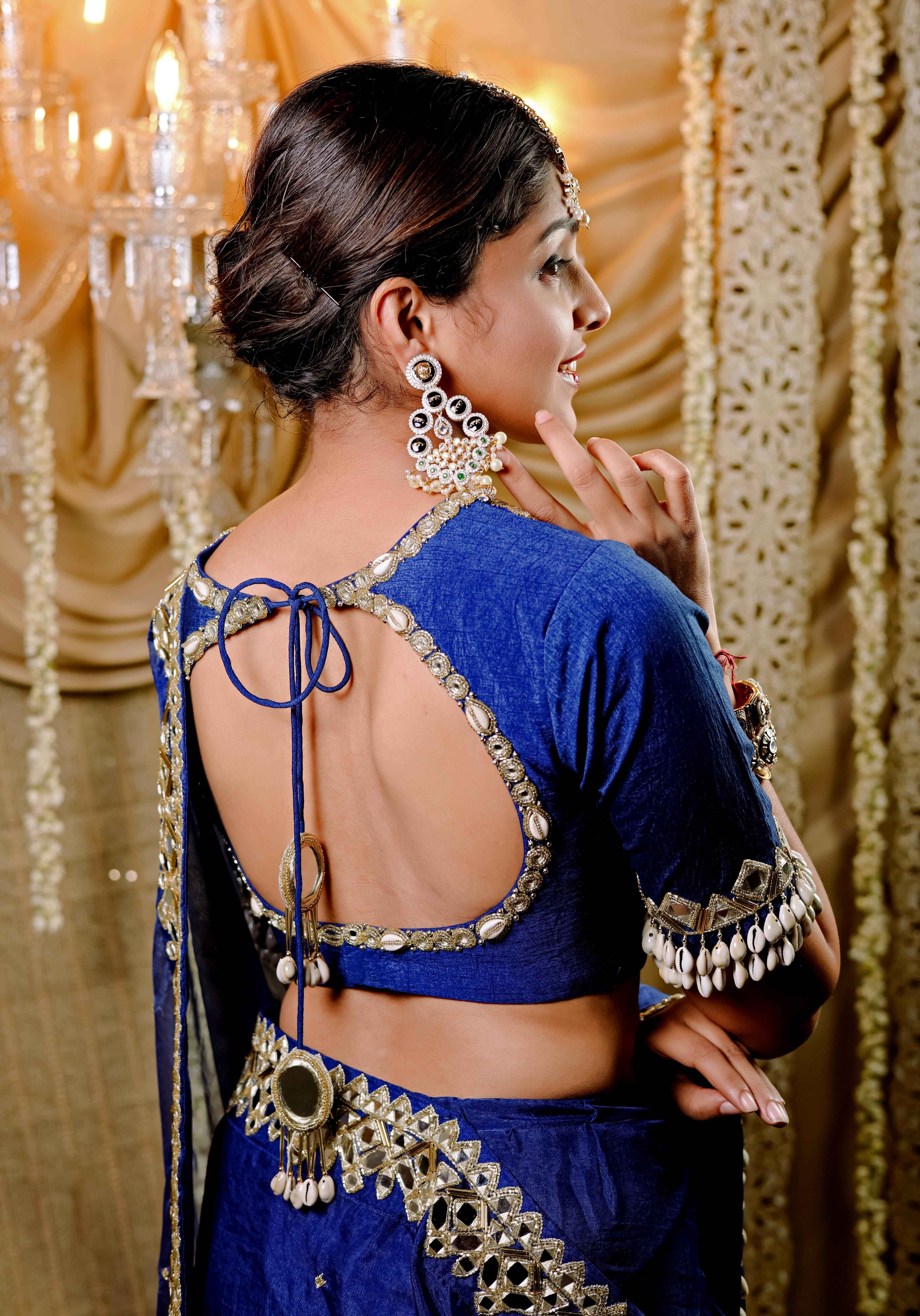 A model showcasing Dark Blue Embroidered Predraped Saree Set by Foram Patel from Foram Patel's collection