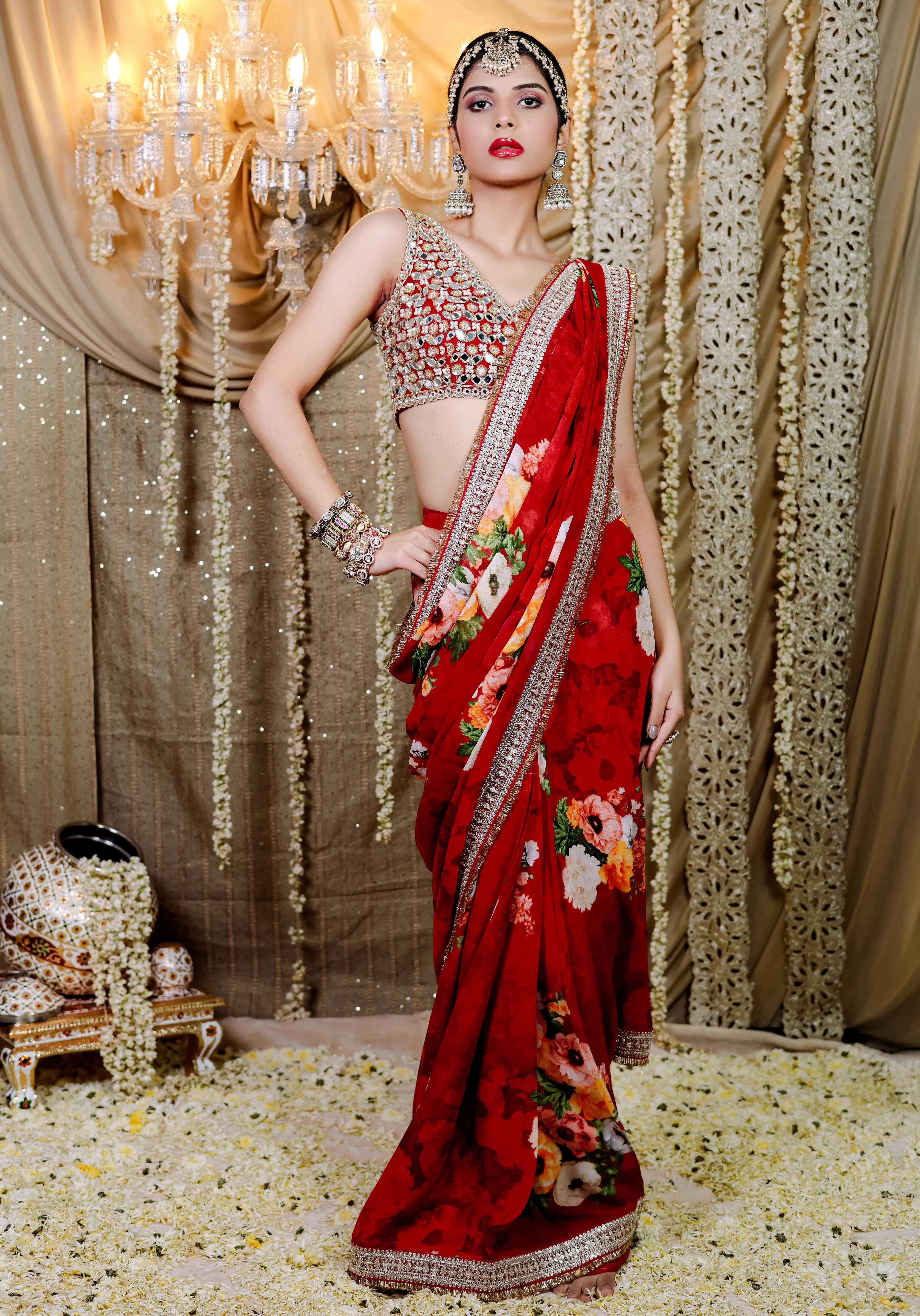 A model showcasing Red Floral Printed Predraped Saree Set by Foram Patel from Foram Patel's collection