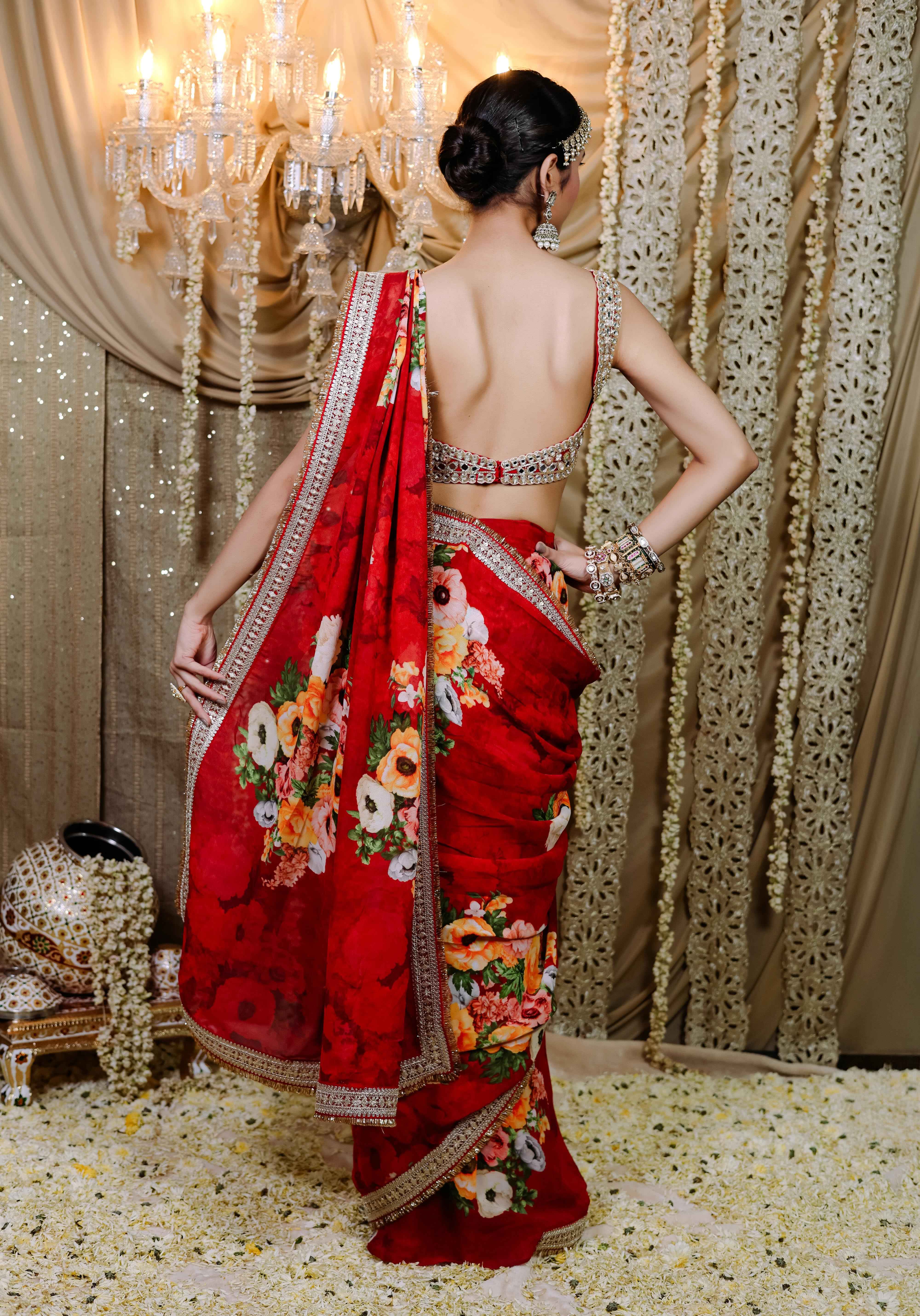 A model showcasing Red Floral Printed Predraped Saree Set by Foram Patel from Foram Patel's collection