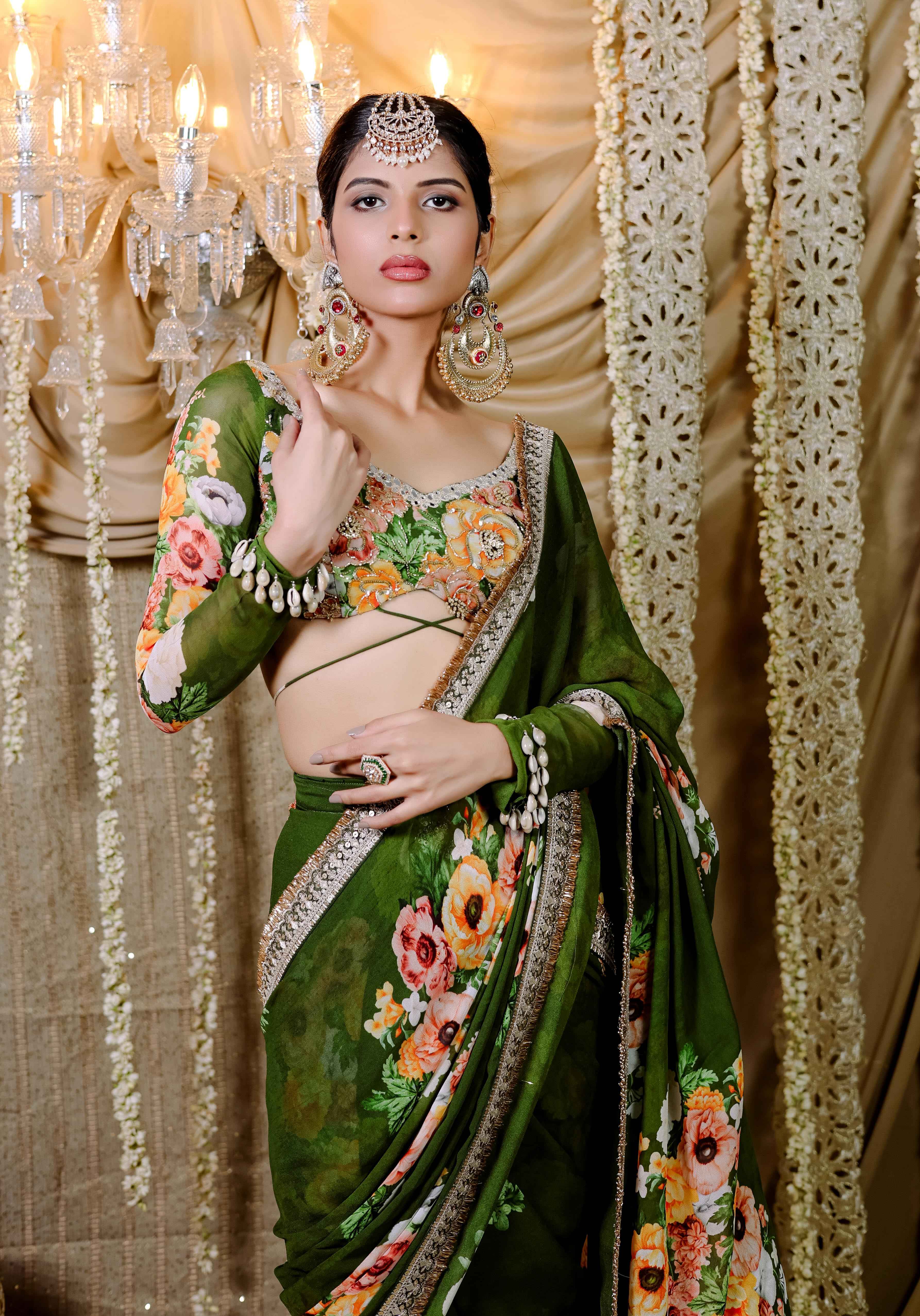 A model showcasing Green Floral Printed Predraped Saree Set by Foram Patel from Foram Patel's collection