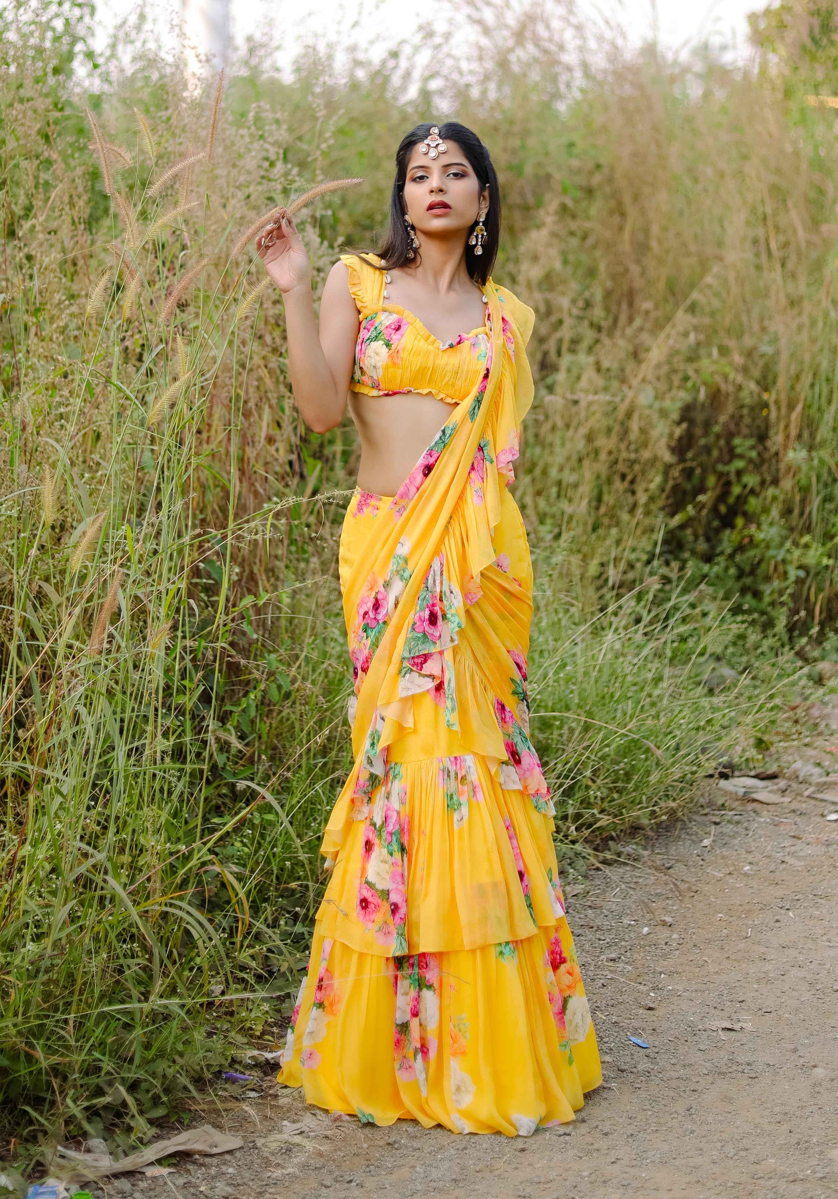 A model showcasing Yellow Floral Printed Predraped Ruffle Saree Set Feature image by Foram Patel from Foram Patel's collection