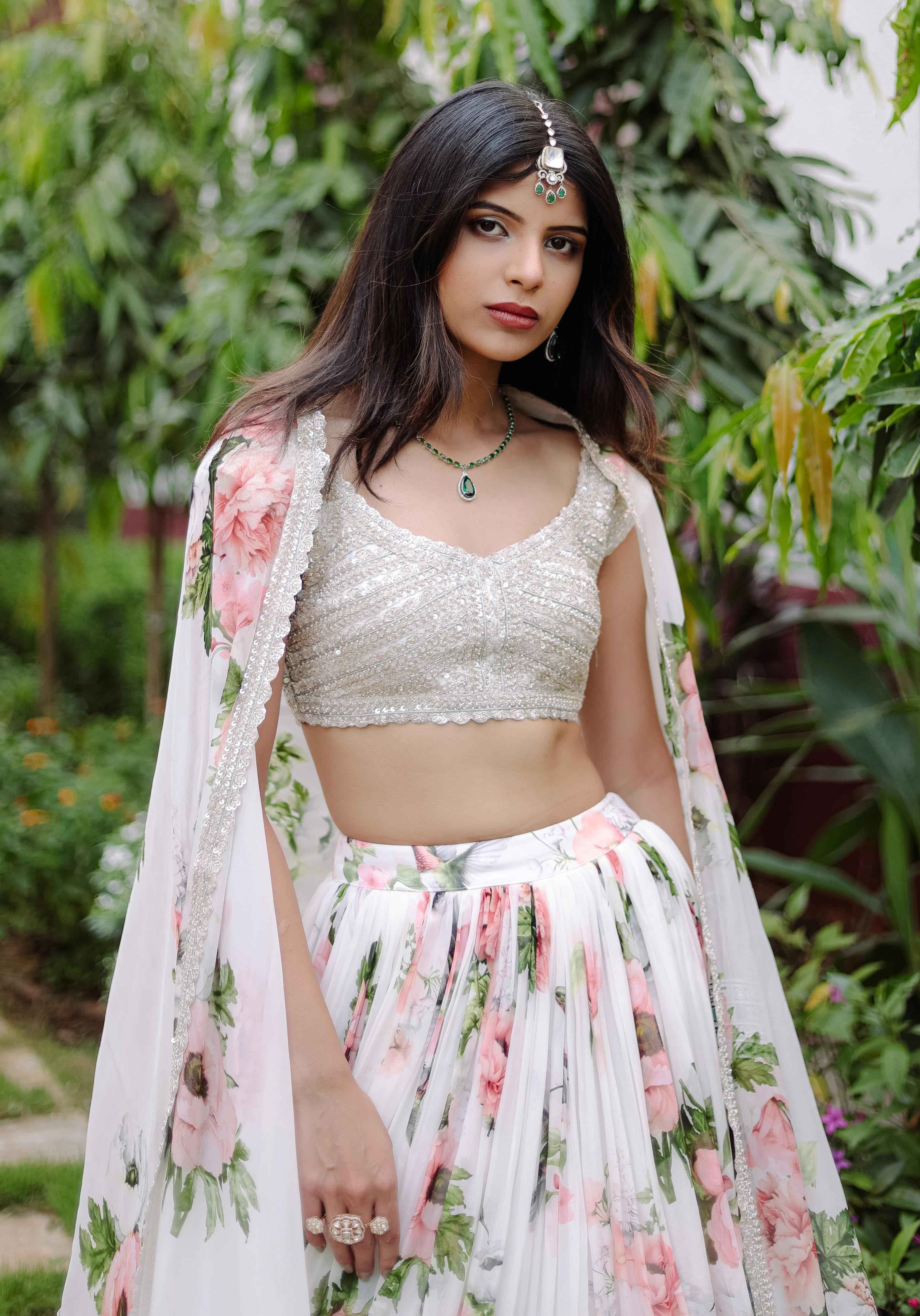 A model showcasing White Floral Printed Lehenga Set by Foram Patel from Foram Patel's collection