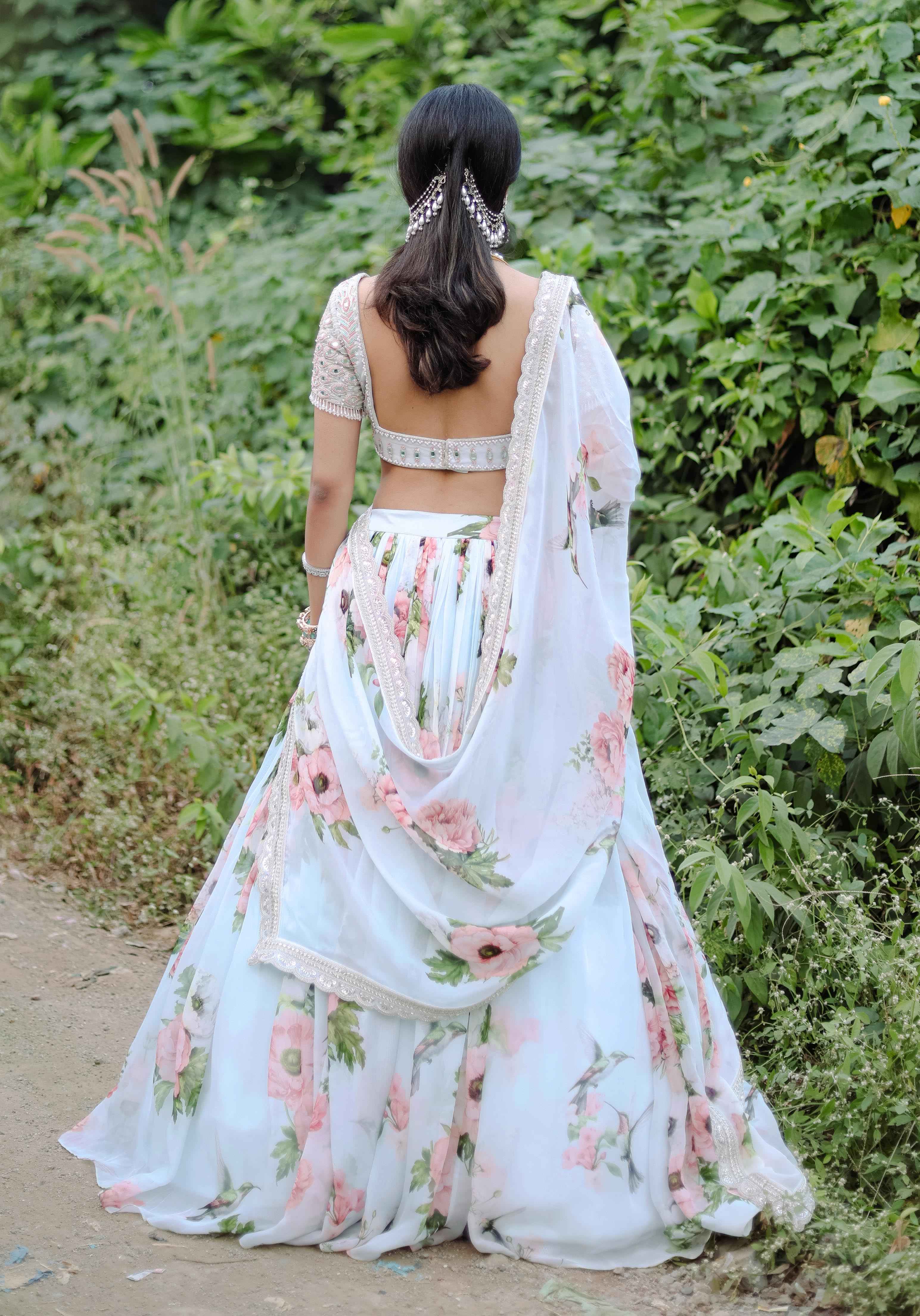 A model showcasing Sky Blue Floral Printed Lehenga Set by Foram Patel from Foram Patel's collection