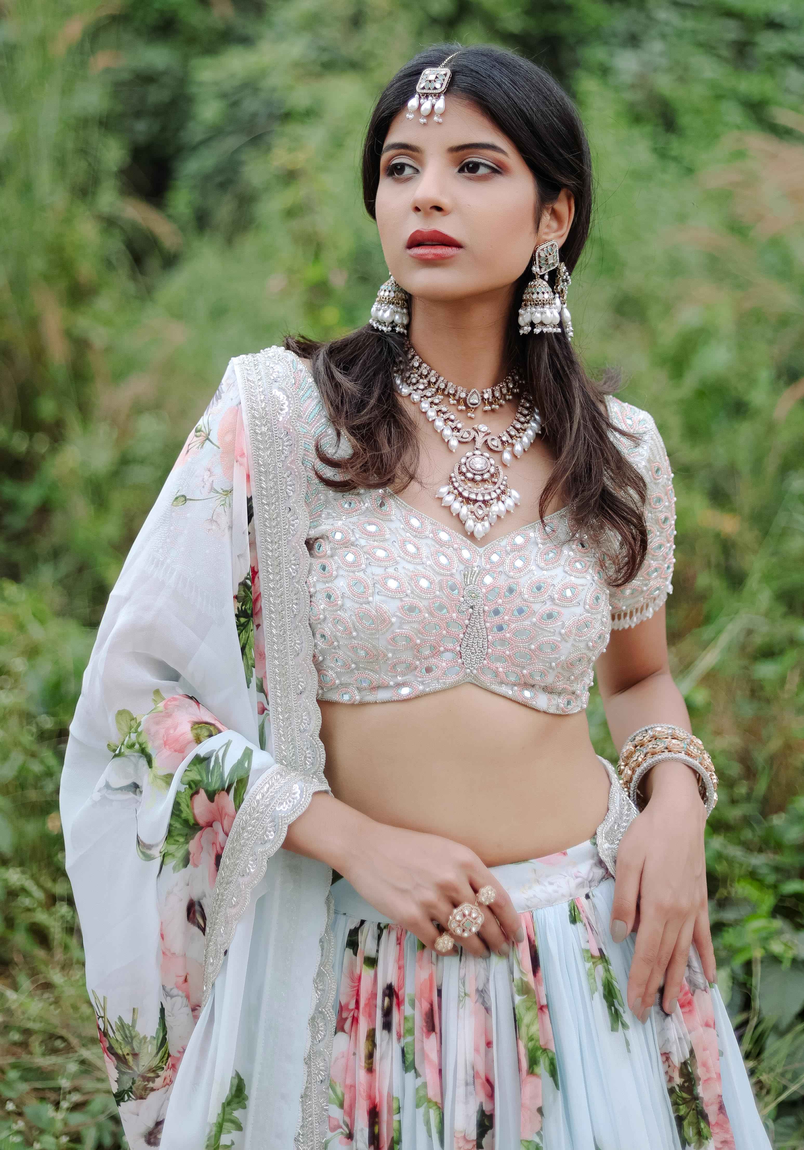 A model showcasing Sky Blue Floral Printed Lehenga Set by Foram Patel from Foram Patel's collection