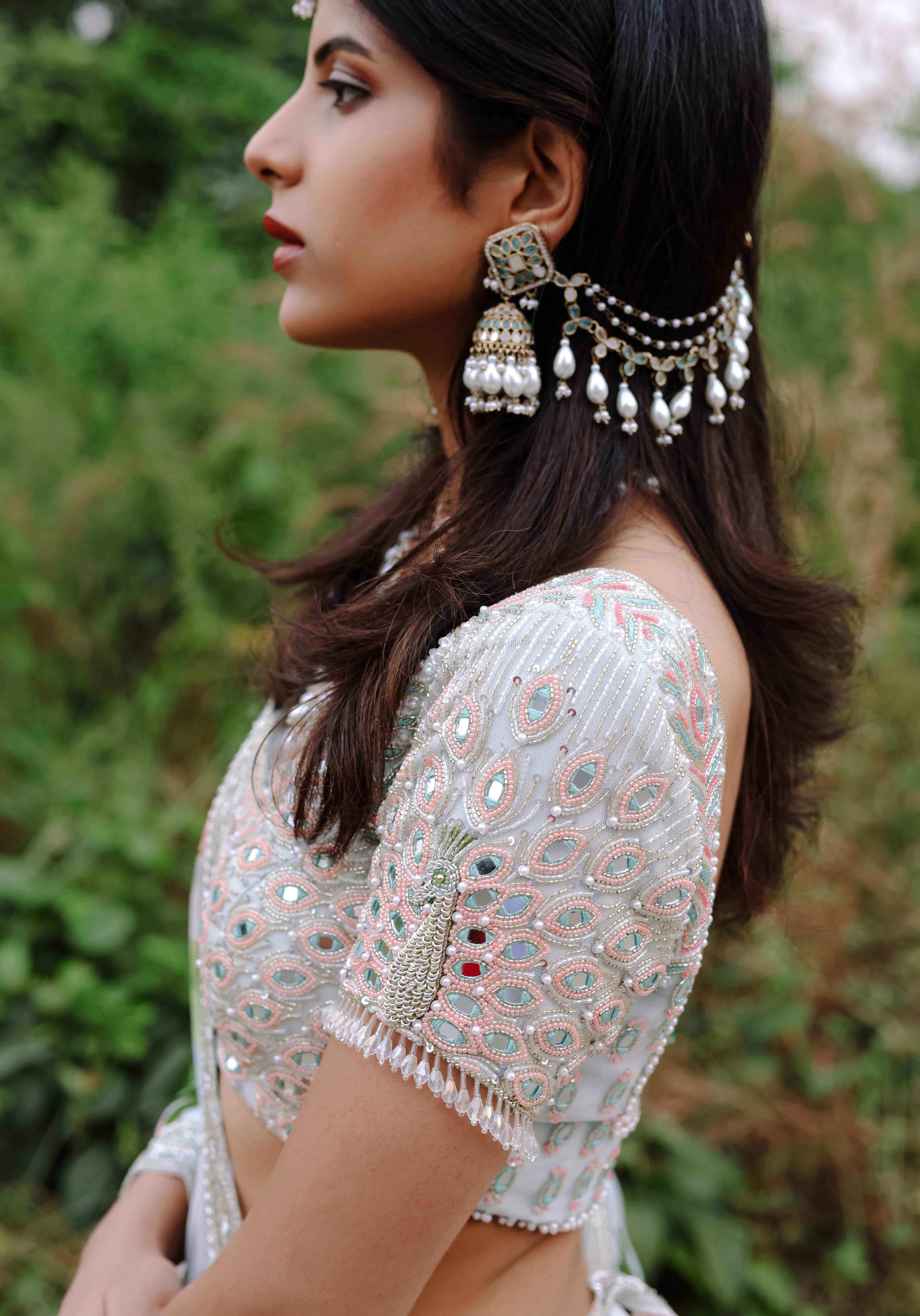 A model showcasing Sky Blue Floral Printed Lehenga Set by Foram Patel from Foram Patel's collection
