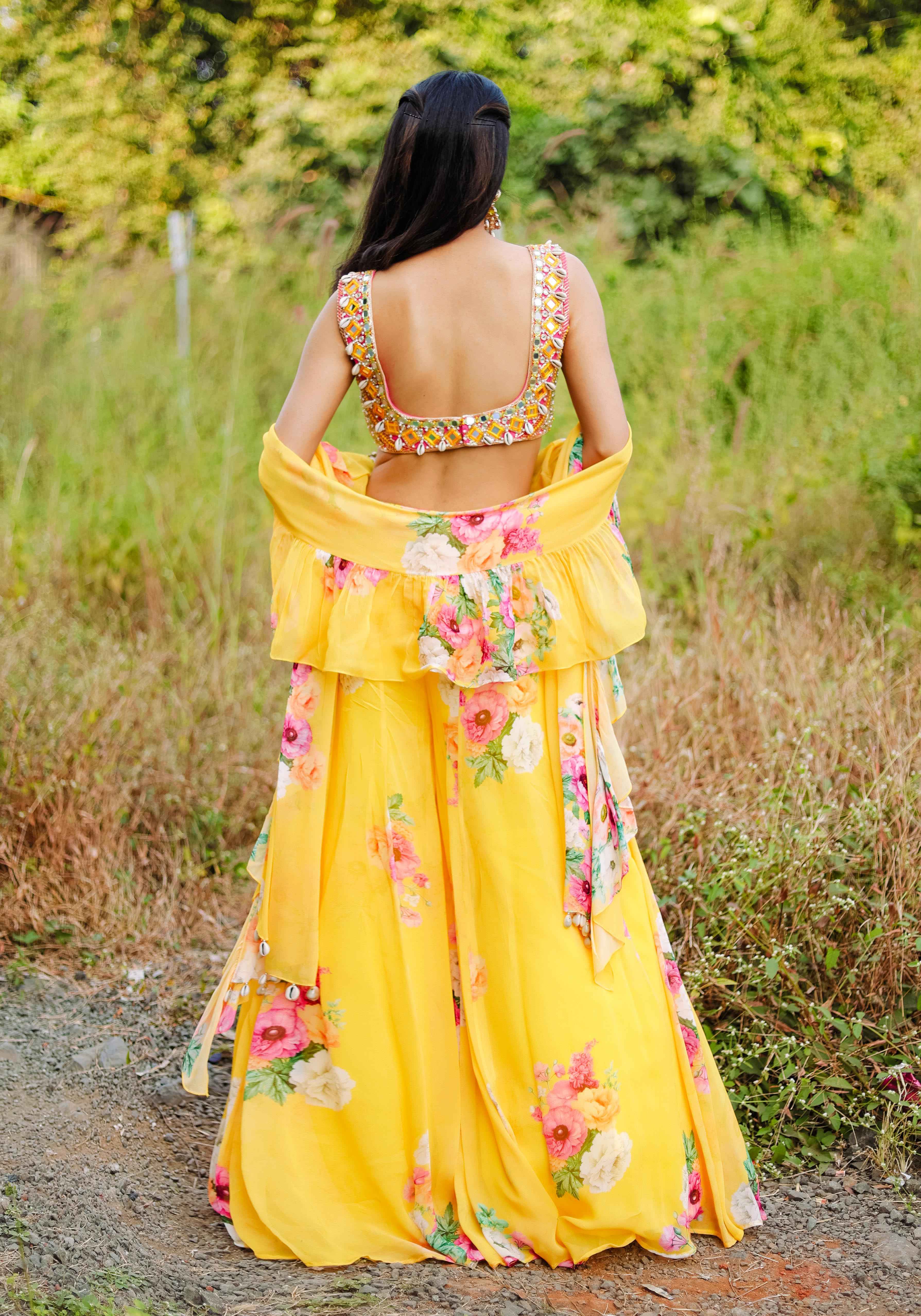 A model showcasing Yellow Mirror And Cowrie Embroidered Coord Set by Foram Patel from Foram Patel's collection A model showcasing Yellow Mirror And Cowrie Embroidered Coord Set by Foram Patel from Foram Patel's collection