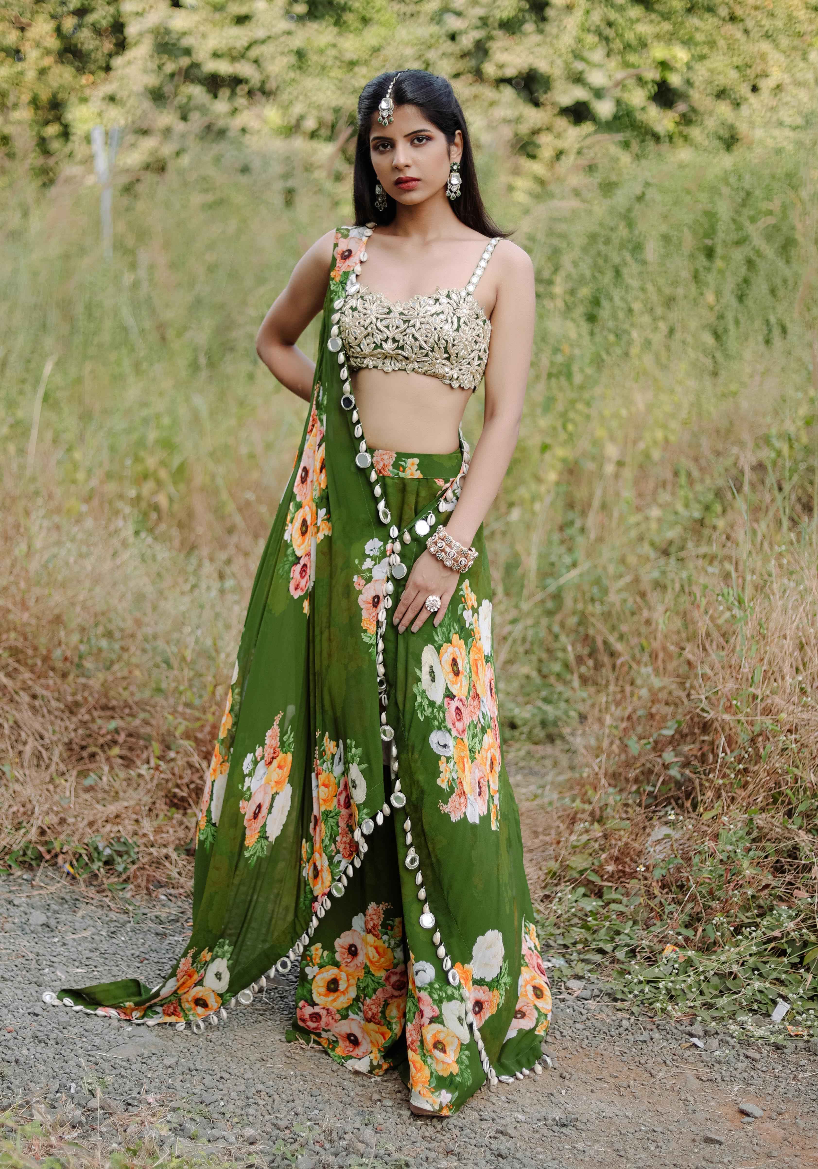 A model showcasing Green Mirror And Cowrie Embroidered Cape Set Feature image by Foram Patel from Foram Patel's collection