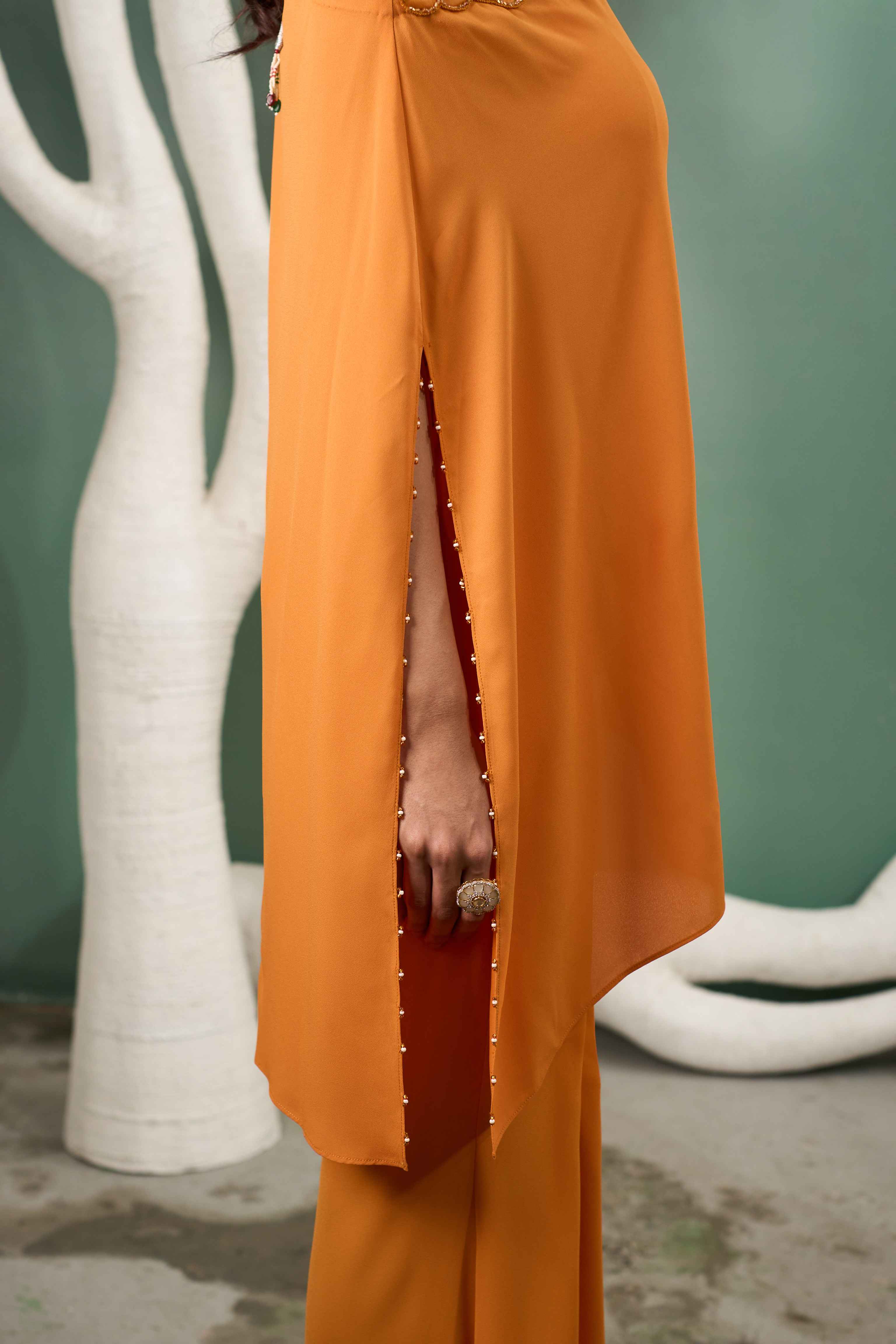 A model showcasing Hand Embroidered Yellow Georgette Coord Set by One Knot One from One Knot One's collection