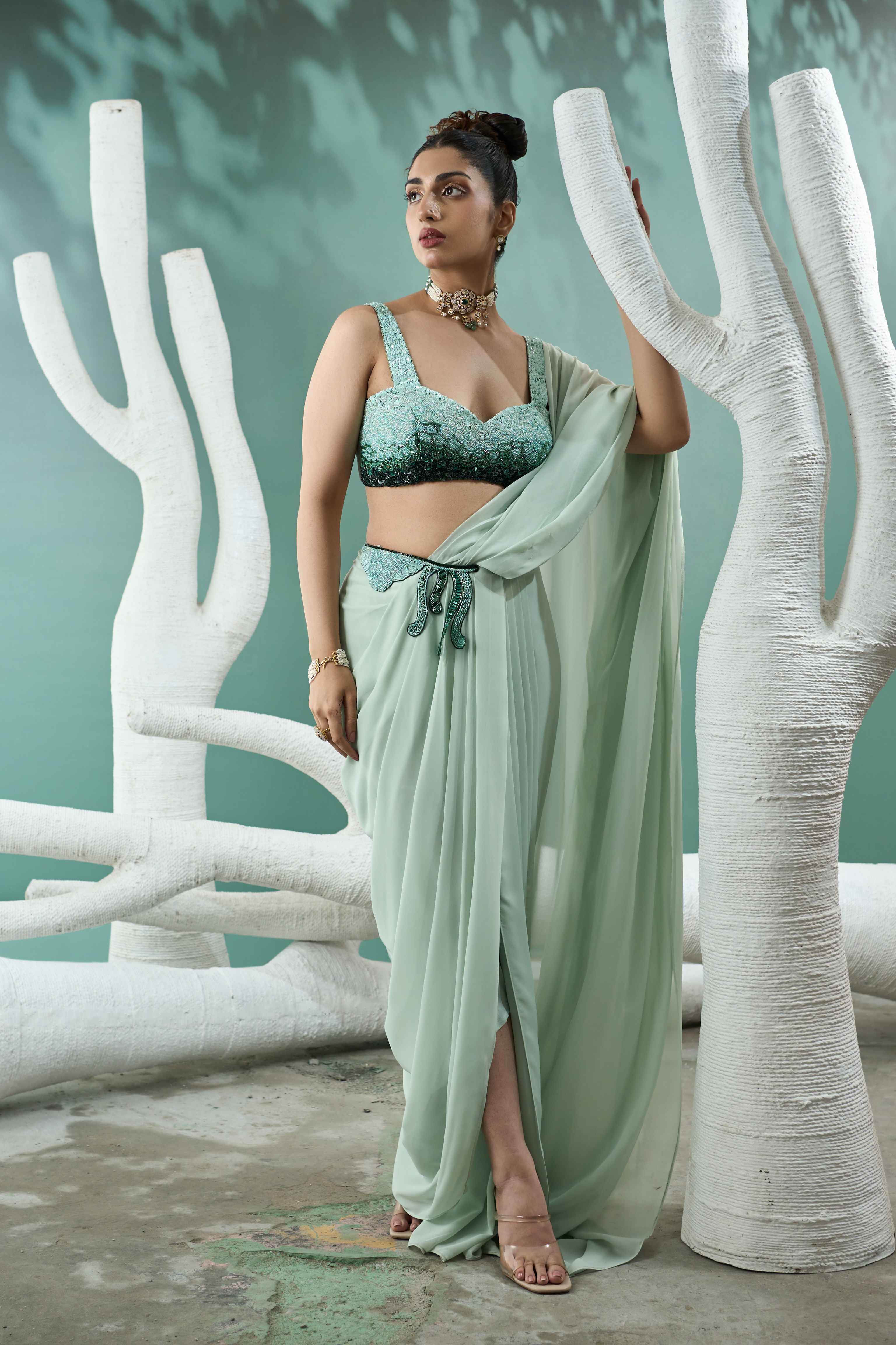 A model showcasing Mint Green Drape Saree Set by One Knot One from One Knot One's collection