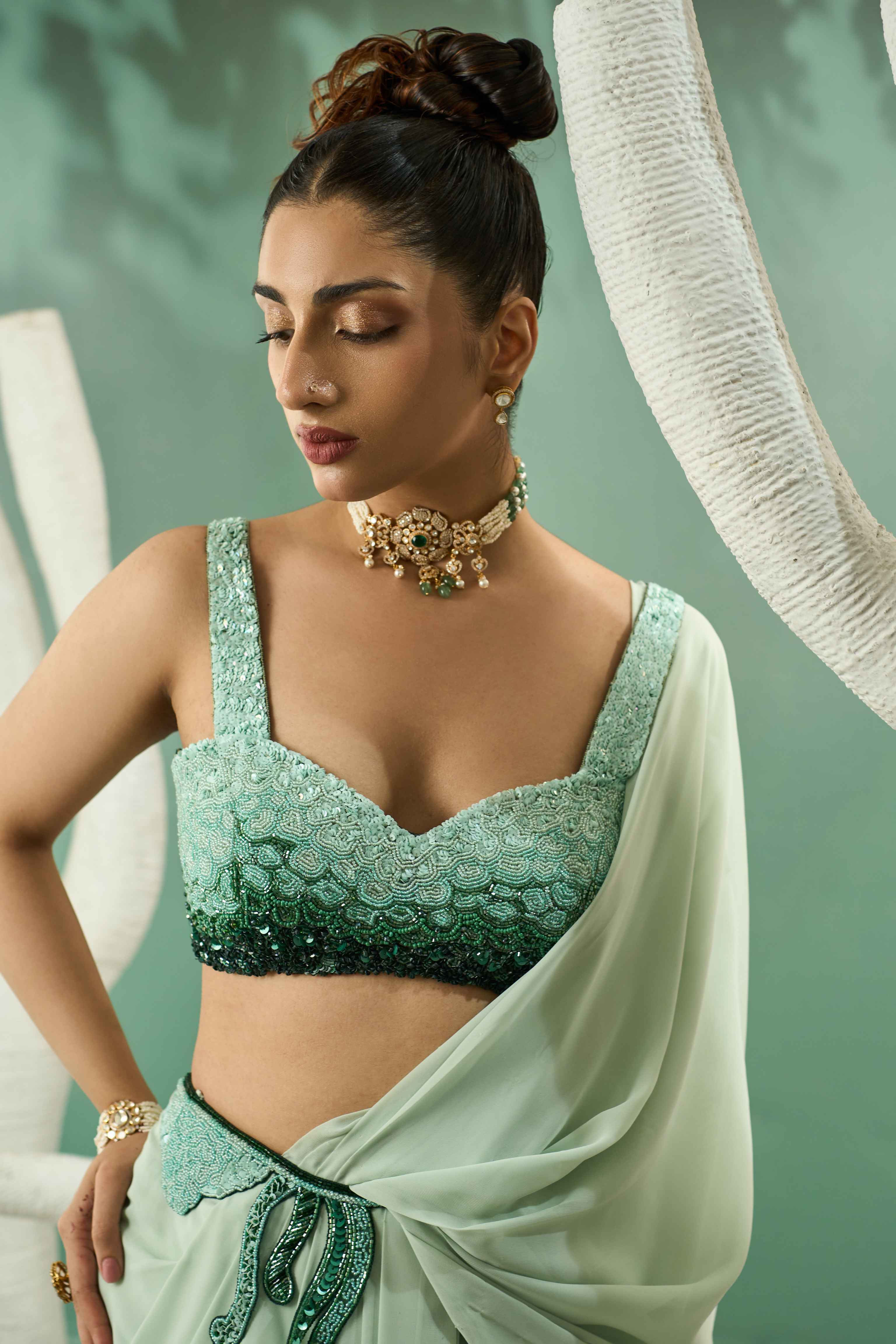 A model showcasing Mint Green Drape Saree Set by One Knot One from One Knot One's collection