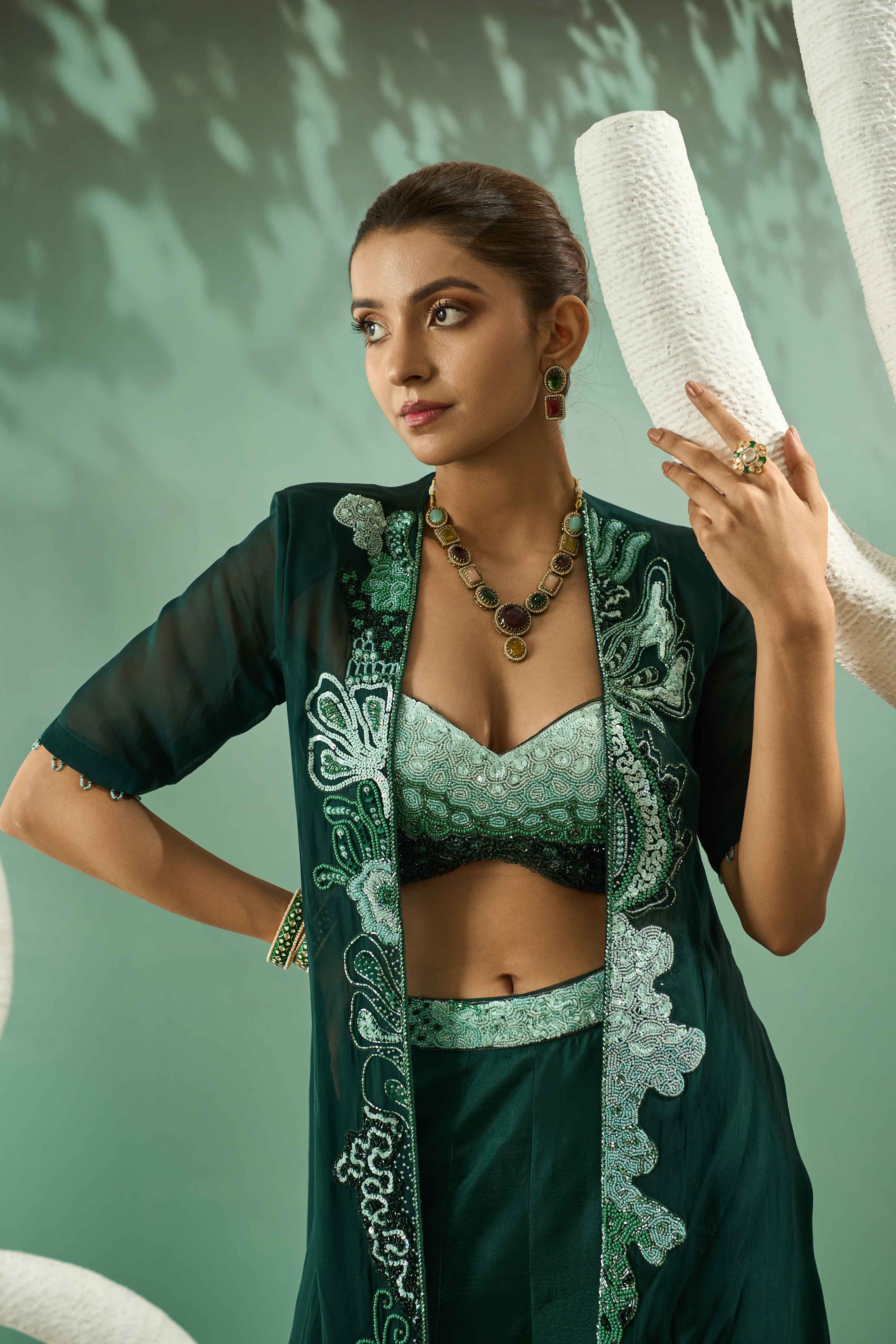 A model showcasing Sharara Set With Ombre Hand Embroidered Blouse And Jacket by One Knot One from One Knot One's collection