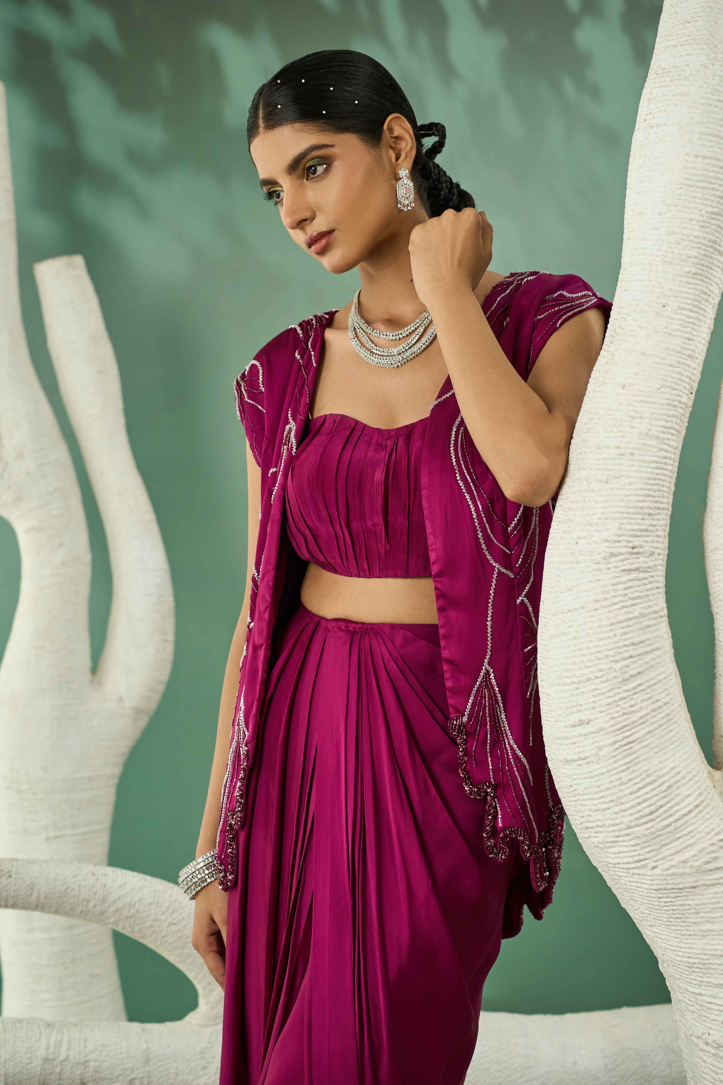 A model showcasing Plum Pink Blazer Skirt Set by One Knot One from One Knot One's collection