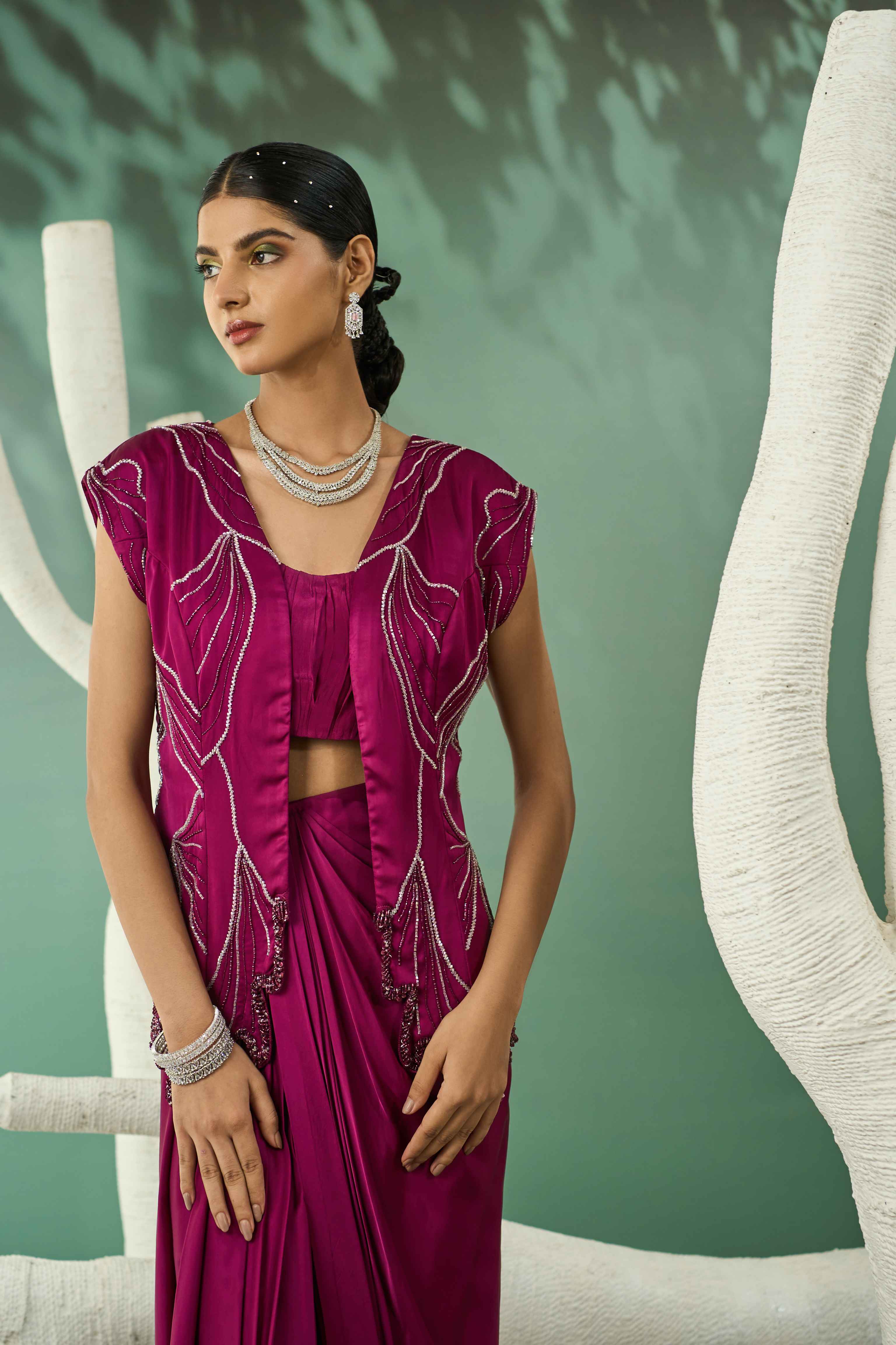 A model showcasing Plum Pink Blazer Skirt Set by One Knot One from One Knot One's collection
