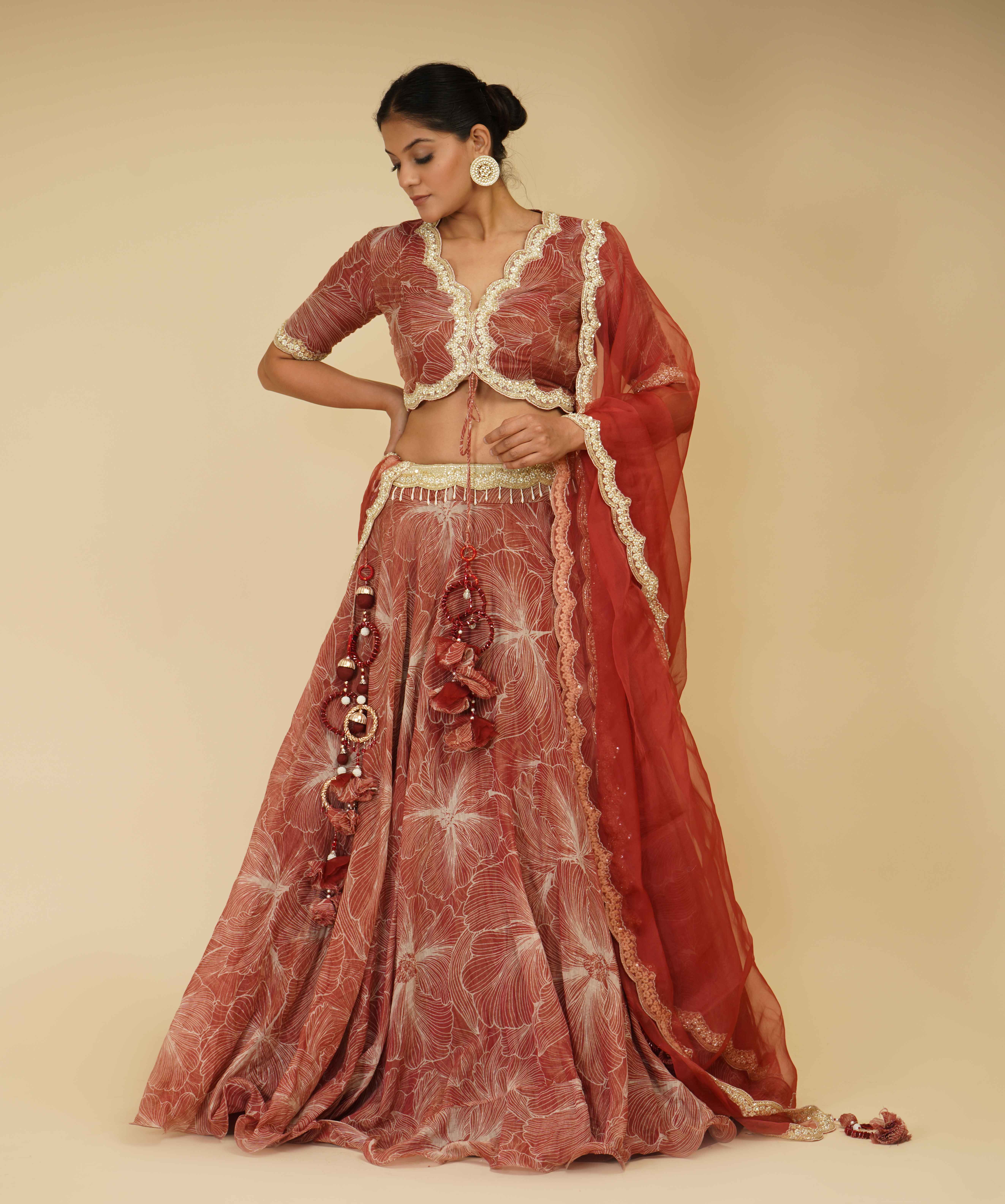A model showcasing Red And Ivory Hand Embroidered Lehenga by Farha Syed from Farha Syed's collection