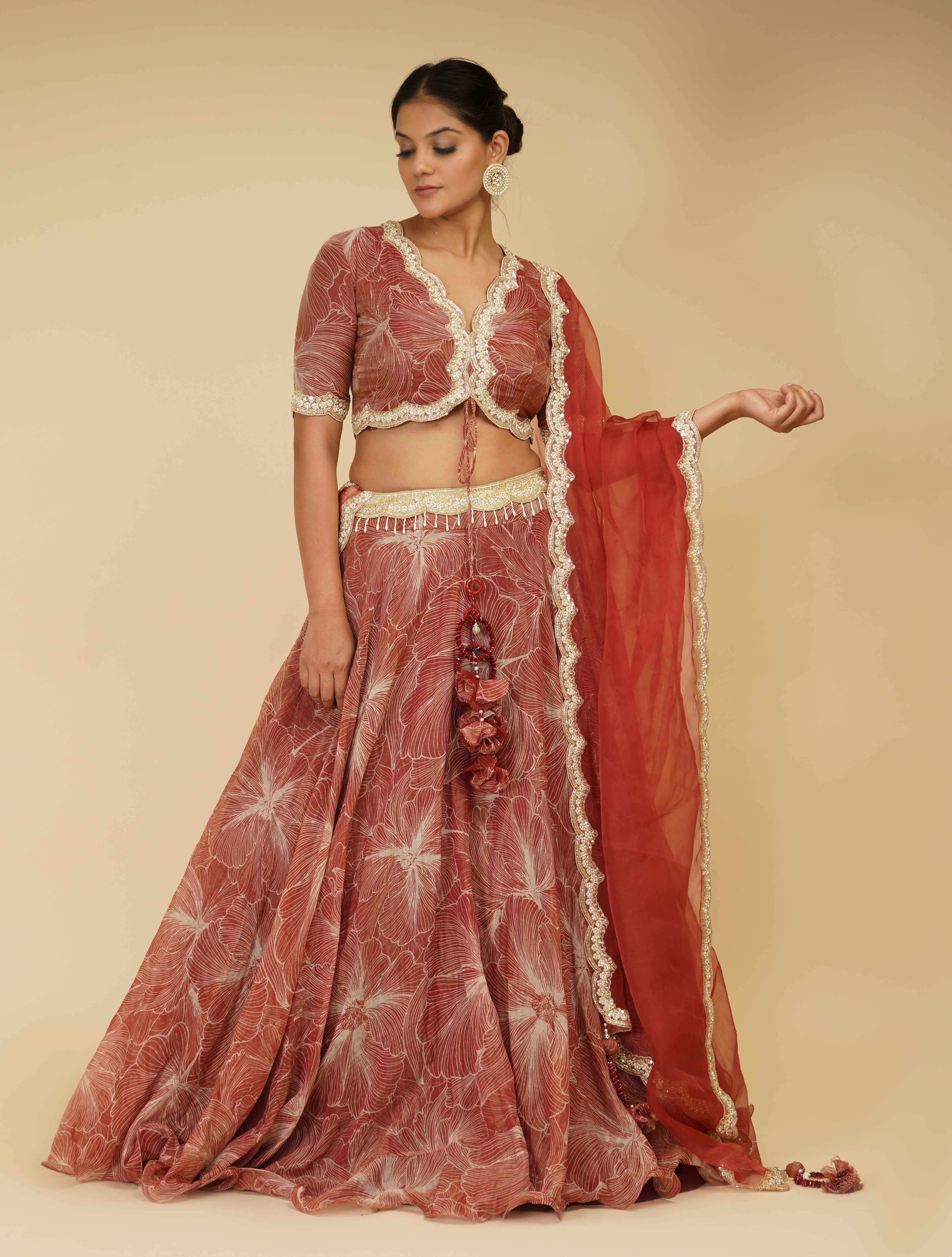 A model showcasing Red And Ivory Hand Embroidered Lehenga by Farha Syed from Farha Syed's collection