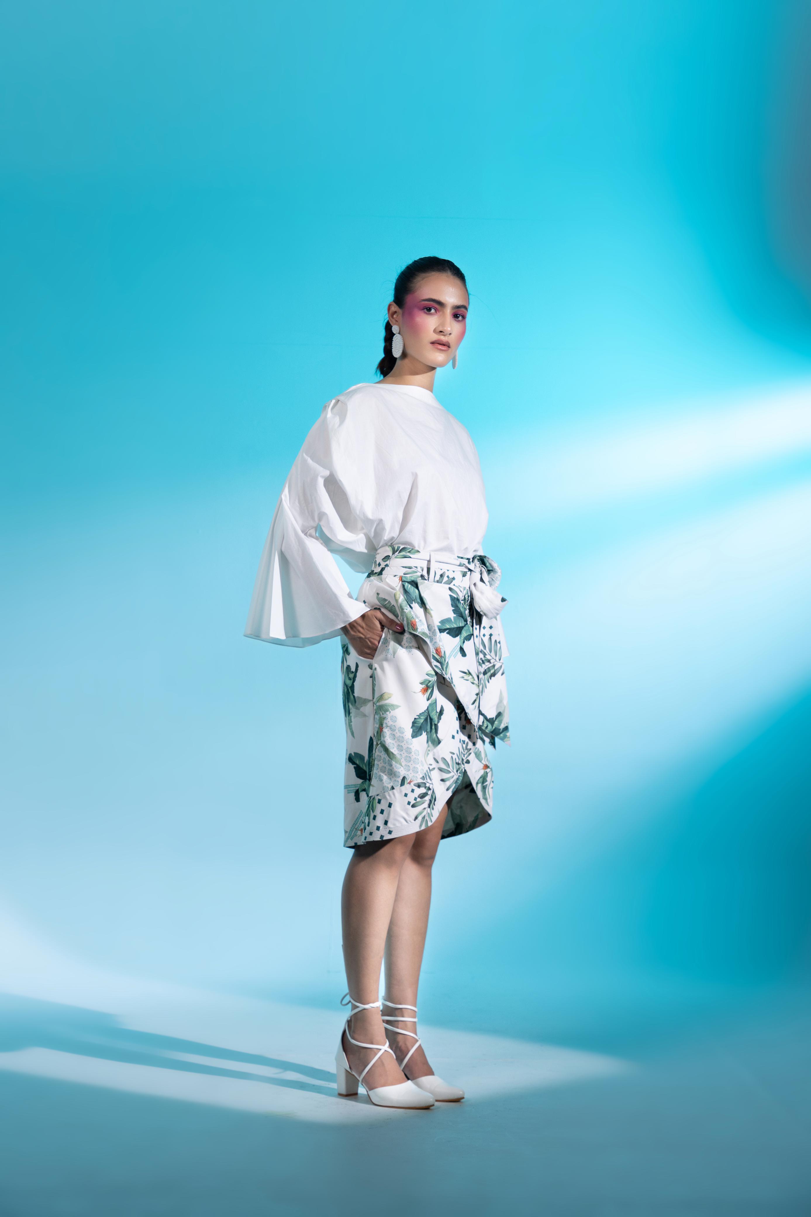 A model showcasing Parc De Bercy Paris Skirt Blouse Set by Miku Kumar from Miku Kumar's collection A model showcasing Parc De Bercy Paris Skirt Blouse Set by Miku Kumar from Miku Kumar's collection