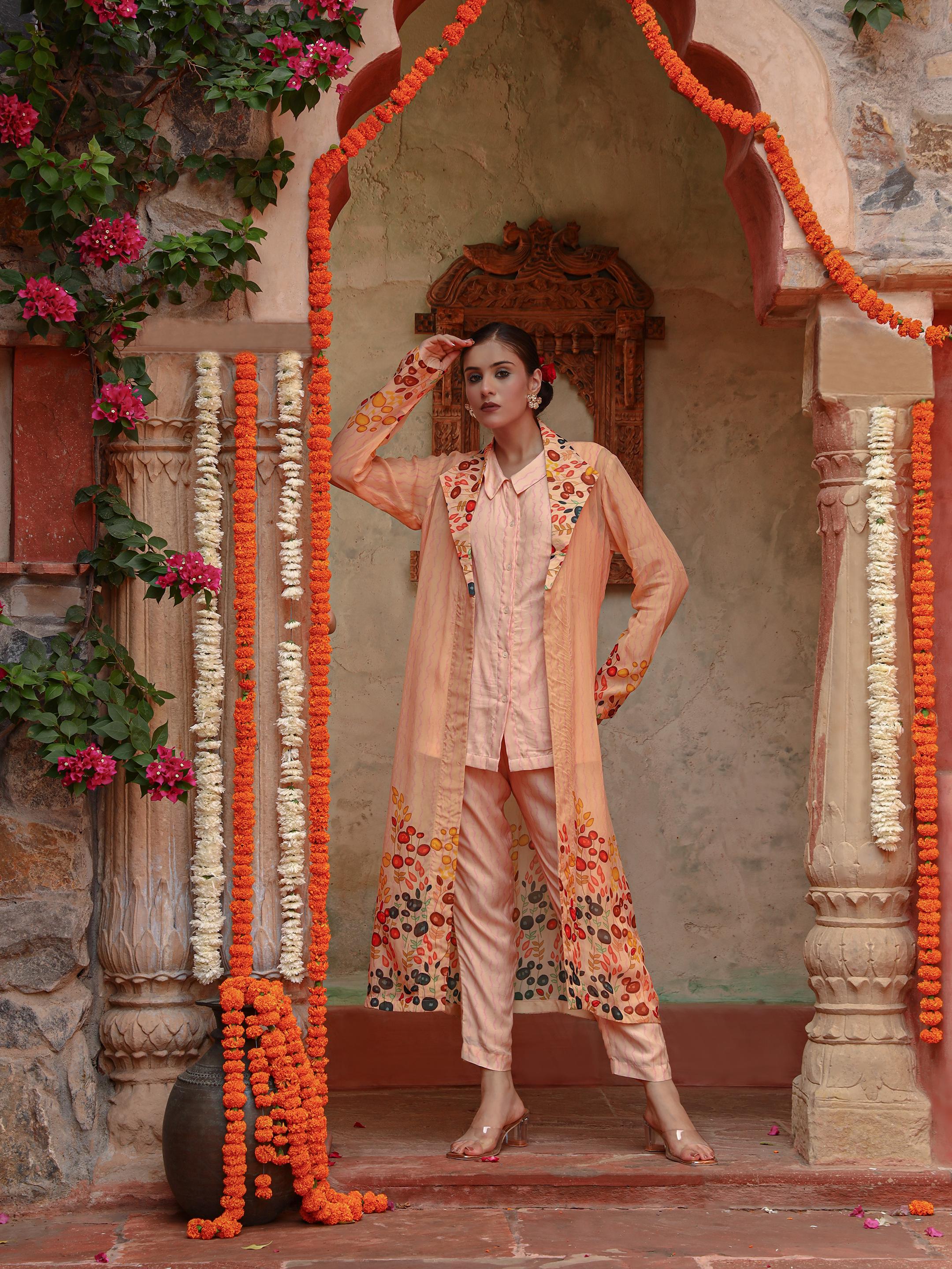 A model showcasing Lila Peach Jacket Set by Miku Kumar from Miku Kumar's collection