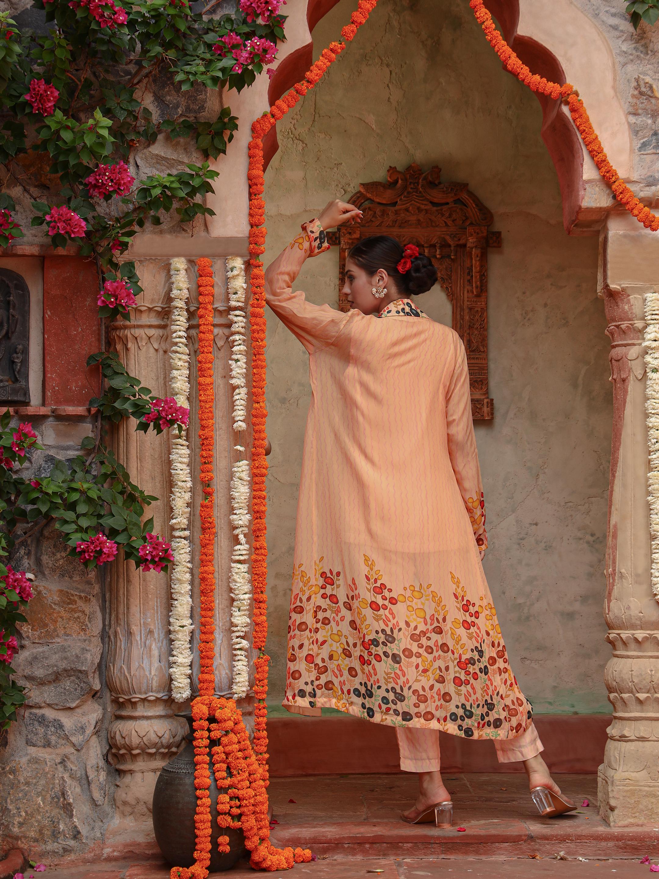 A model showcasing Lila Peach Jacket Set by Miku Kumar from Miku Kumar's collection