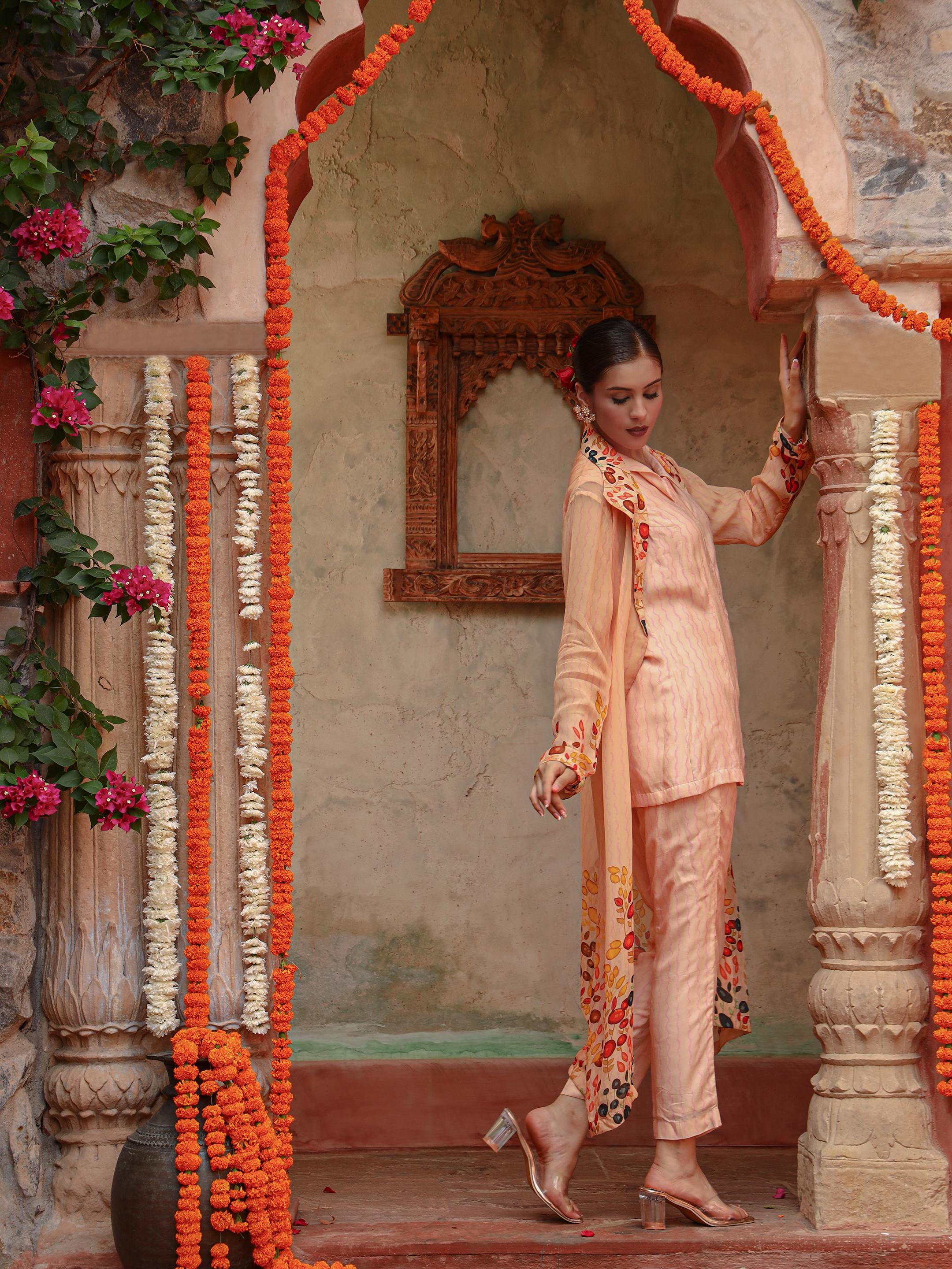 A model showcasing Lila Peach Jacket Set by Miku Kumar from Miku Kumar's collection