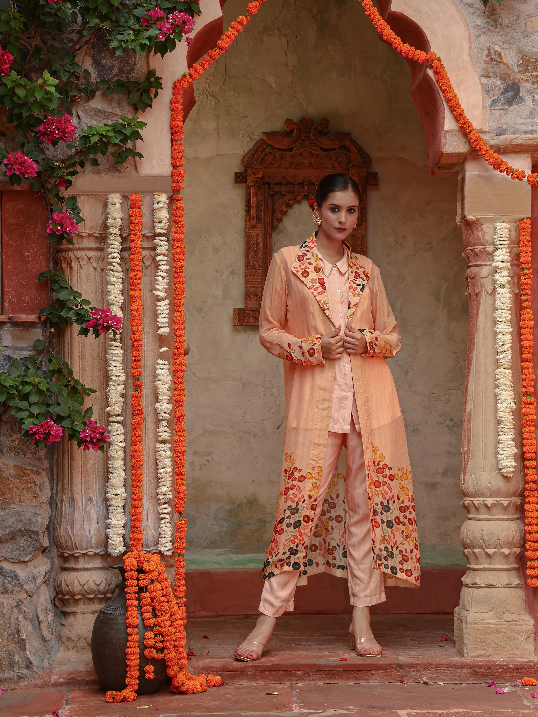 A model showcasing Lila Peach Jacket Set by Miku Kumar from Miku Kumar's collection