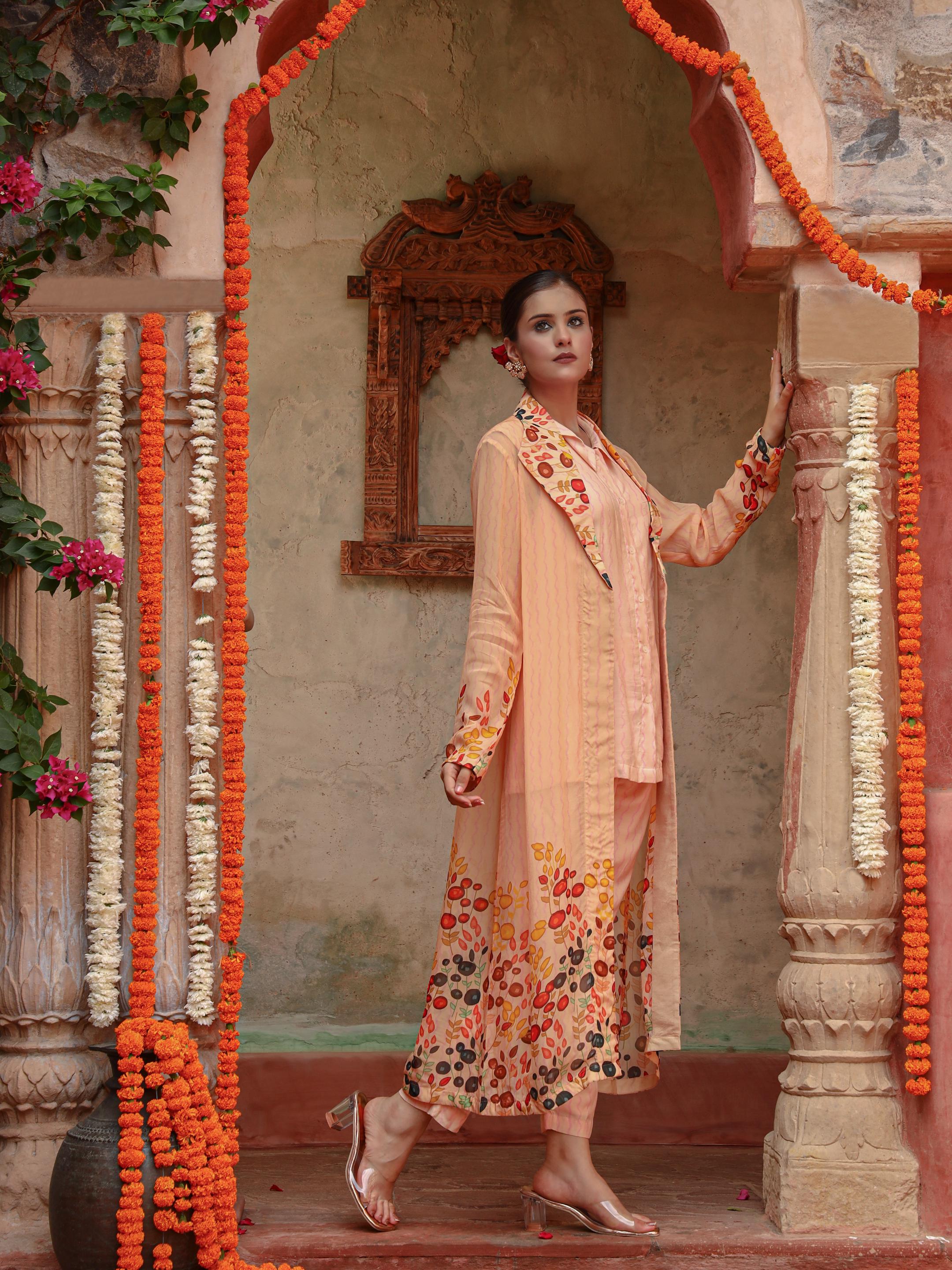A model showcasing Lila Peach Jacket Set by Miku Kumar from Miku Kumar's collection