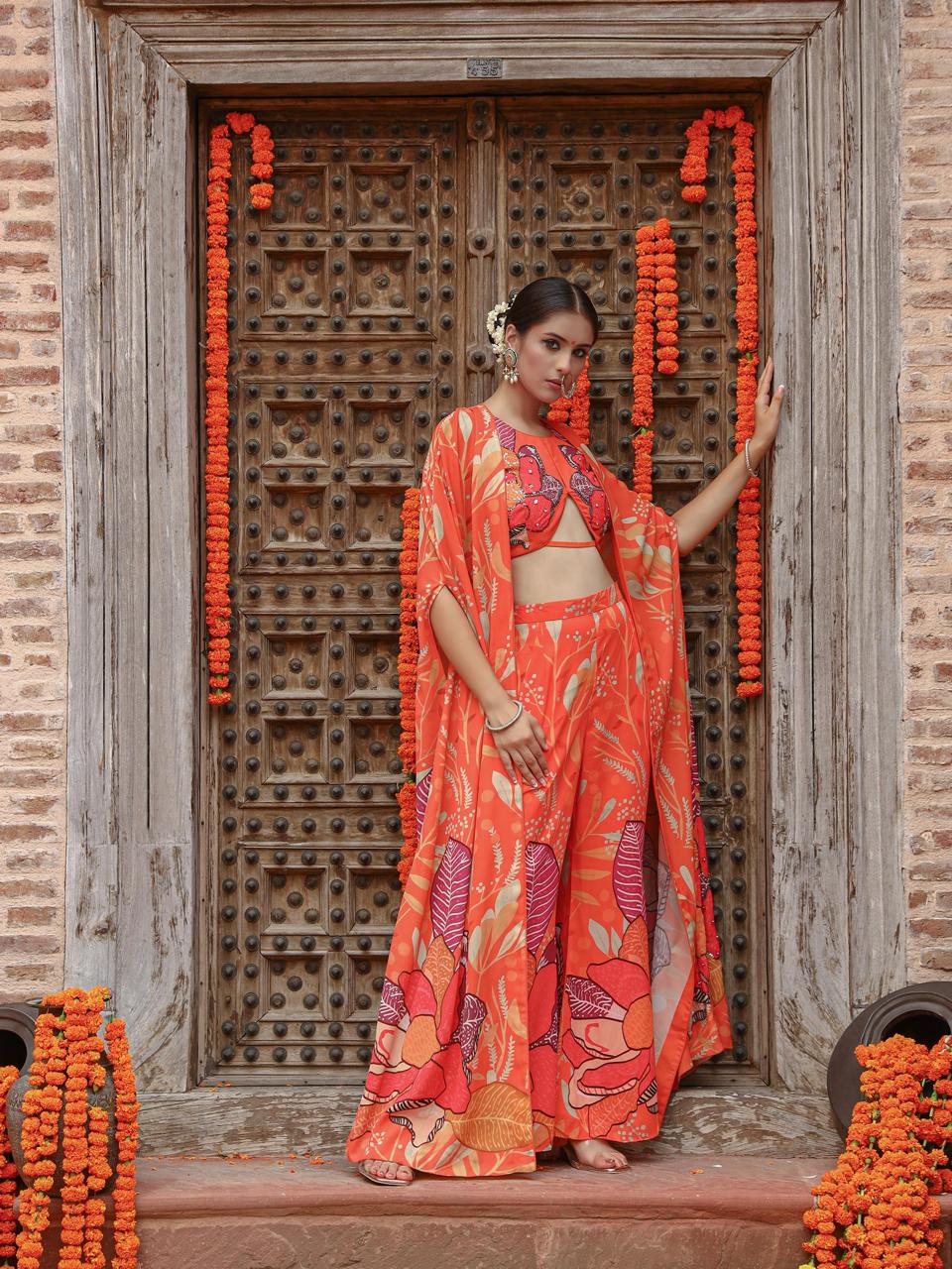 A model showcasing Keya Palazzo Cape Set by Miku Kumar from Miku Kumar's collection