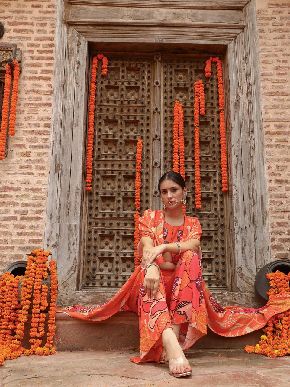 A model showcasing Keya Palazzo Cape Set by Miku Kumar from Miku Kumar's collection