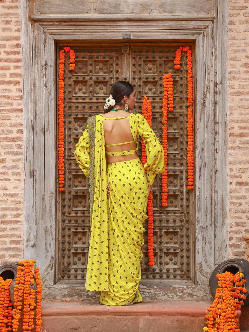 A model showcasing Tiana Drape Saree Set by Miku Kumar from Miku Kumar's collection