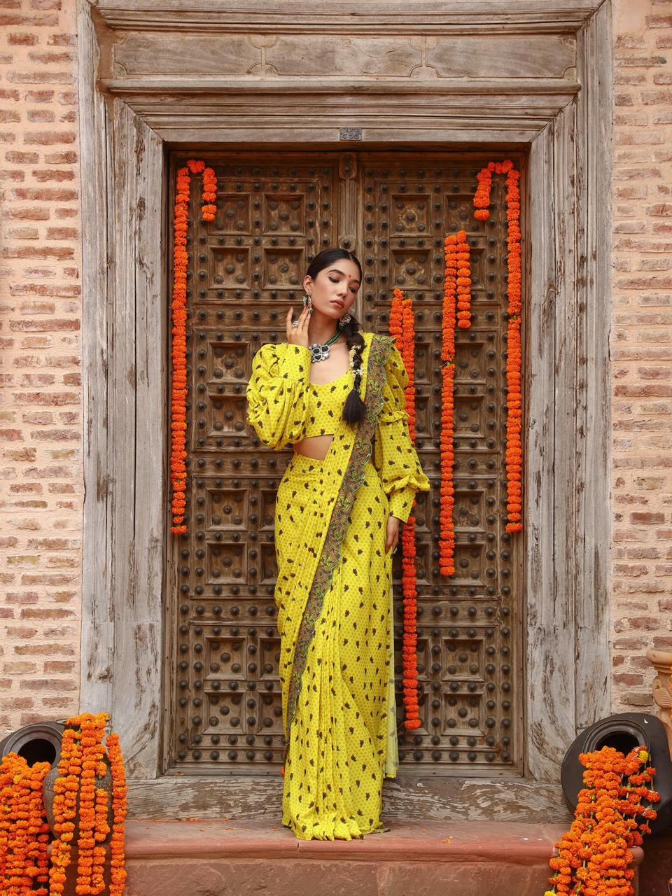 A model showcasing Tiana Drape Saree Set by Miku Kumar from Miku Kumar's collection