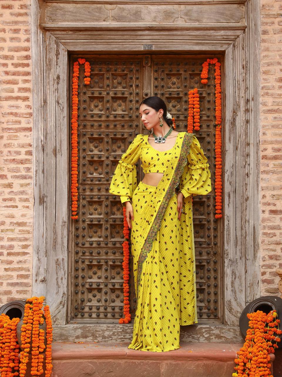 A model showcasing Tiana Drape Saree Set by Miku Kumar from Miku Kumar's collection