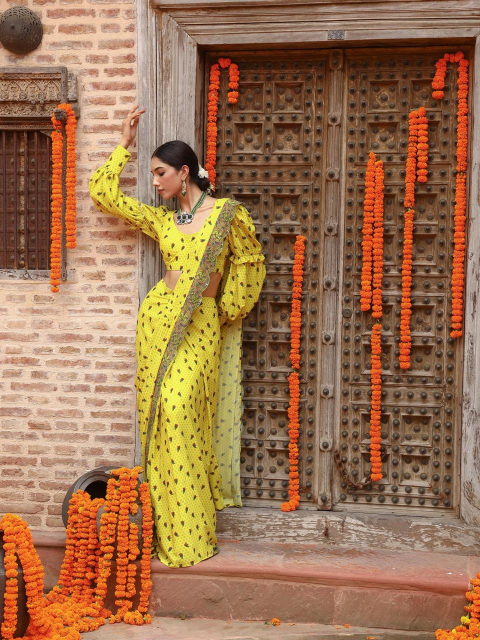 A model showcasing Tiana Drape Saree Set by Miku Kumar from Miku Kumar's collection